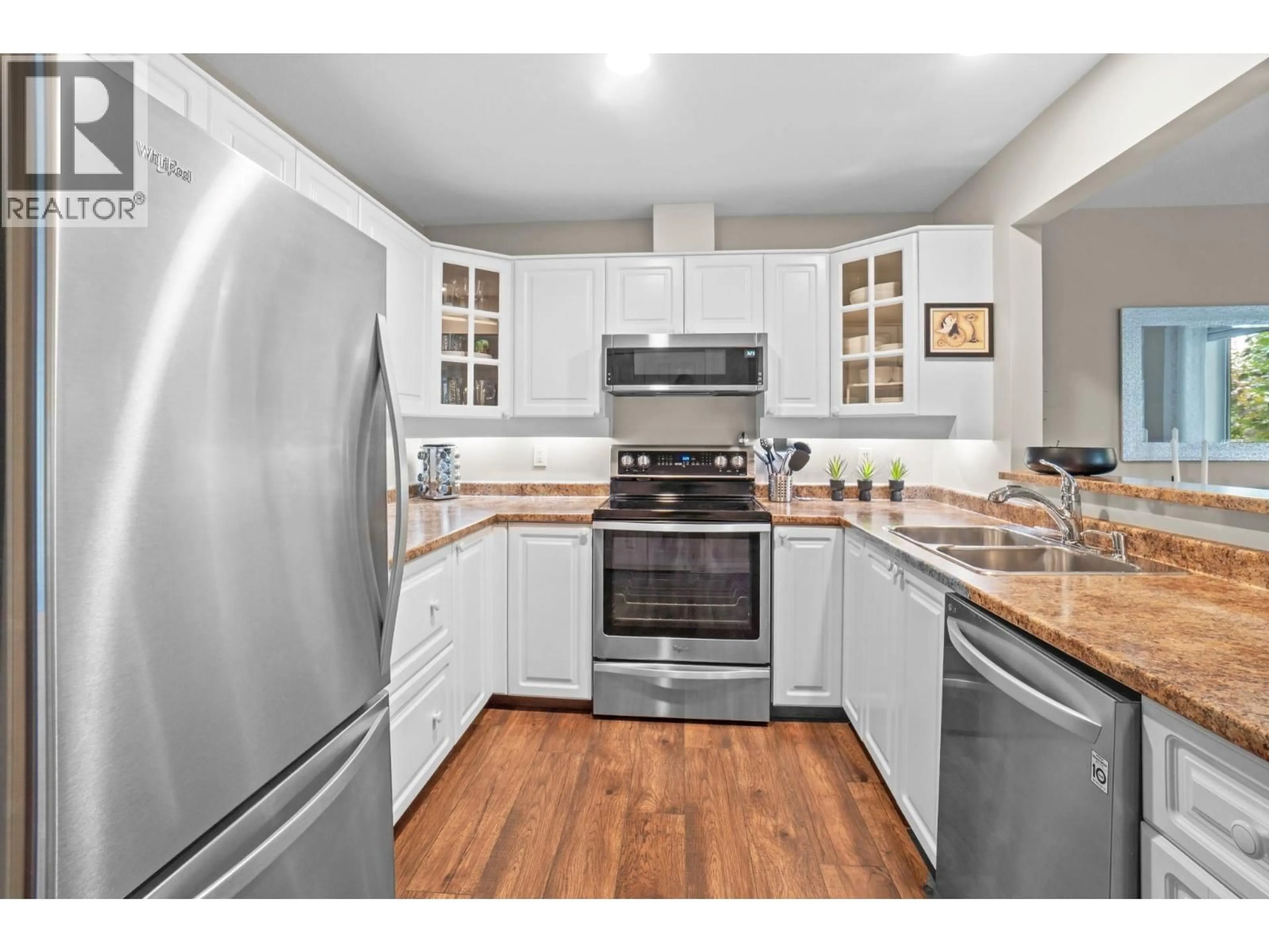 Standard kitchen, wood/laminate floor for 202 - 3283 CASORSO ROAD, Kelowna British Columbia V1W3L6