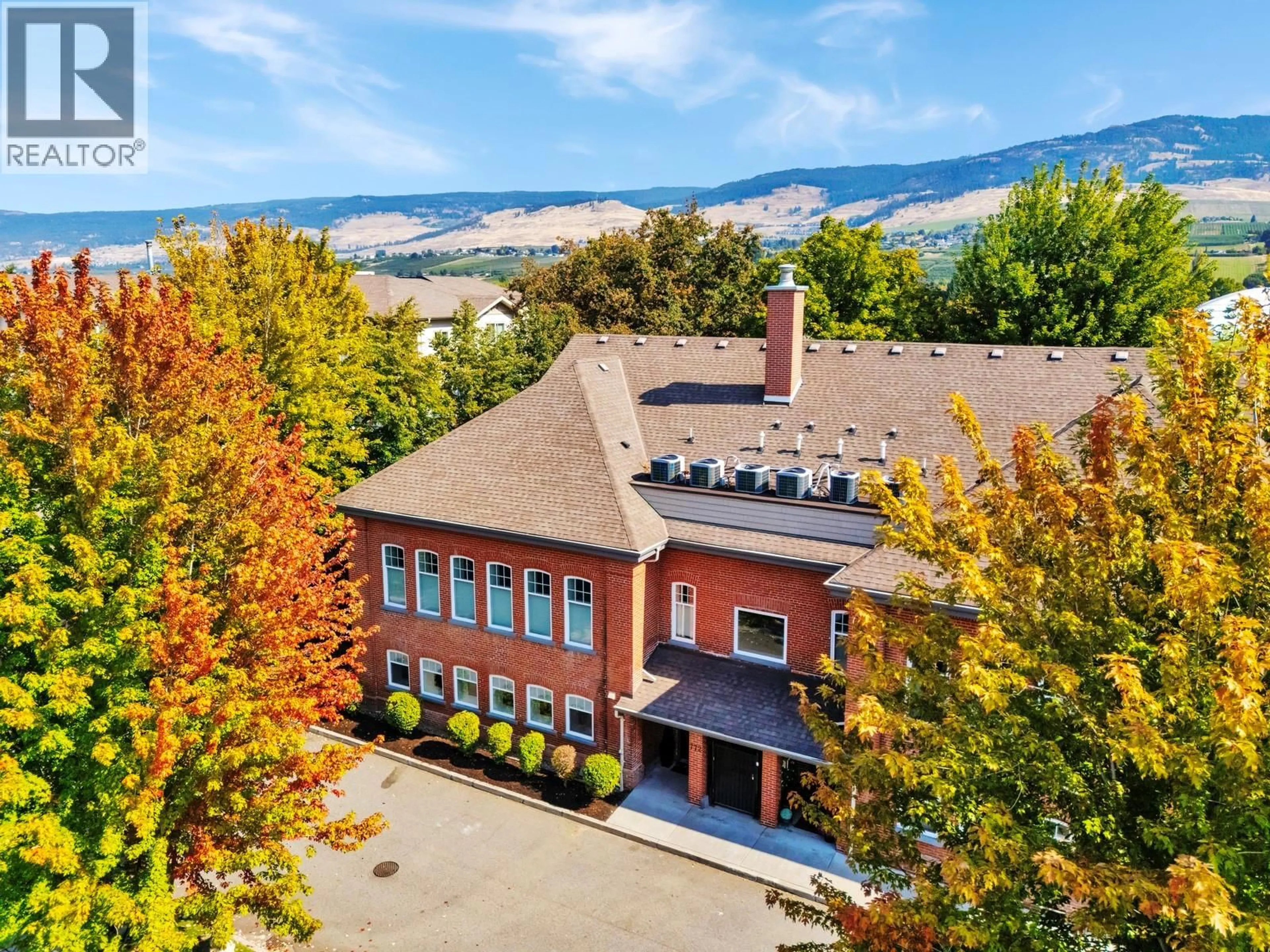 A pic from outside/outdoor area/front of a property/back of a property/a pic from drone, mountain view for 104 - 772 RUTLAND ROAD NORTH, Kelowna British Columbia V1X3B7