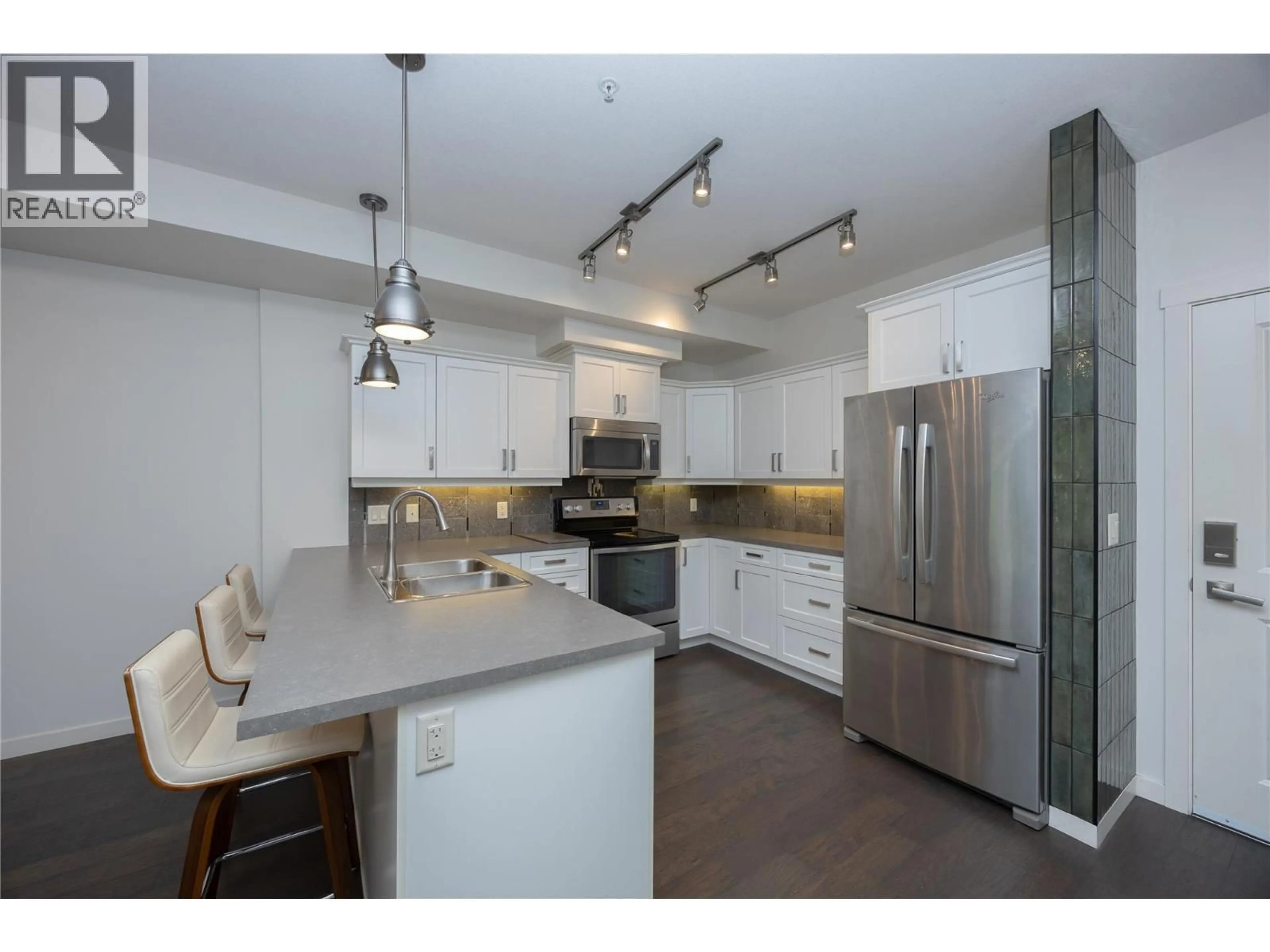 Open concept kitchen, unknown for 103 - 3733 CASORSO ROAD, Kelowna British Columbia V1W5E3