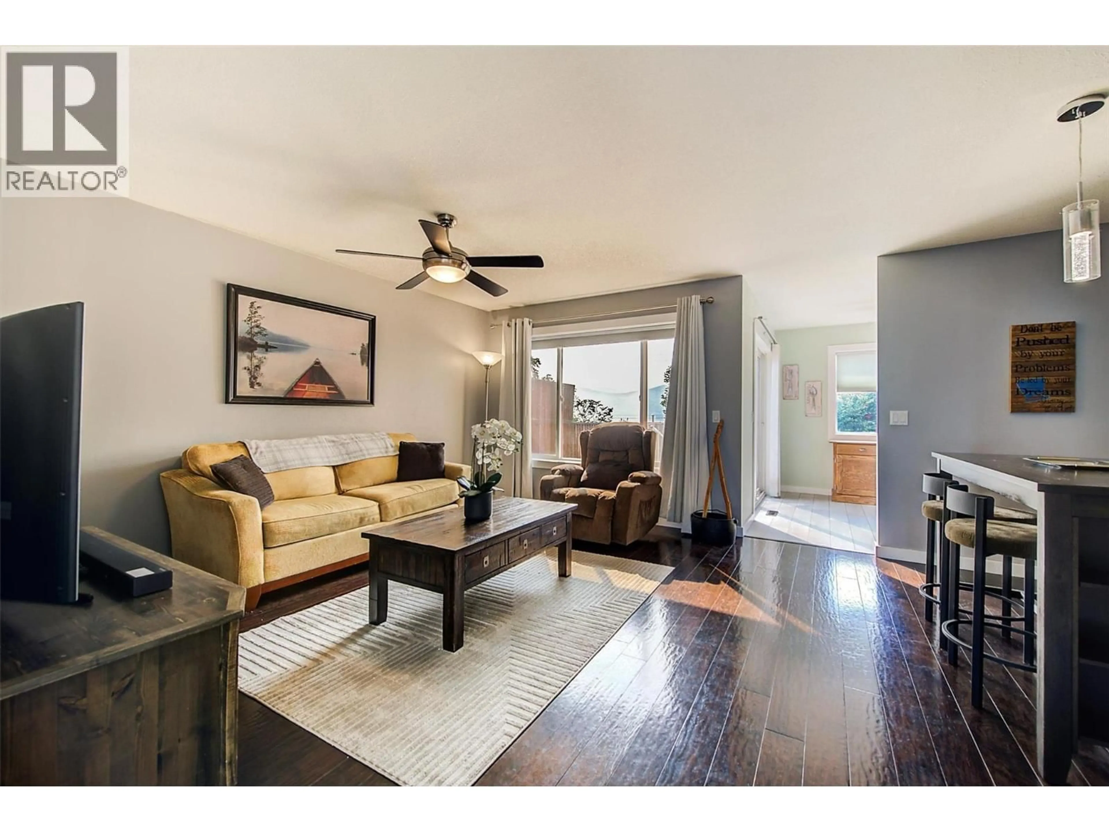 Living room with furniture, wood/laminate floor for 307 - 2440 OLD OKANAGAN HIGHWAY, West Kelowna British Columbia V4T1X6