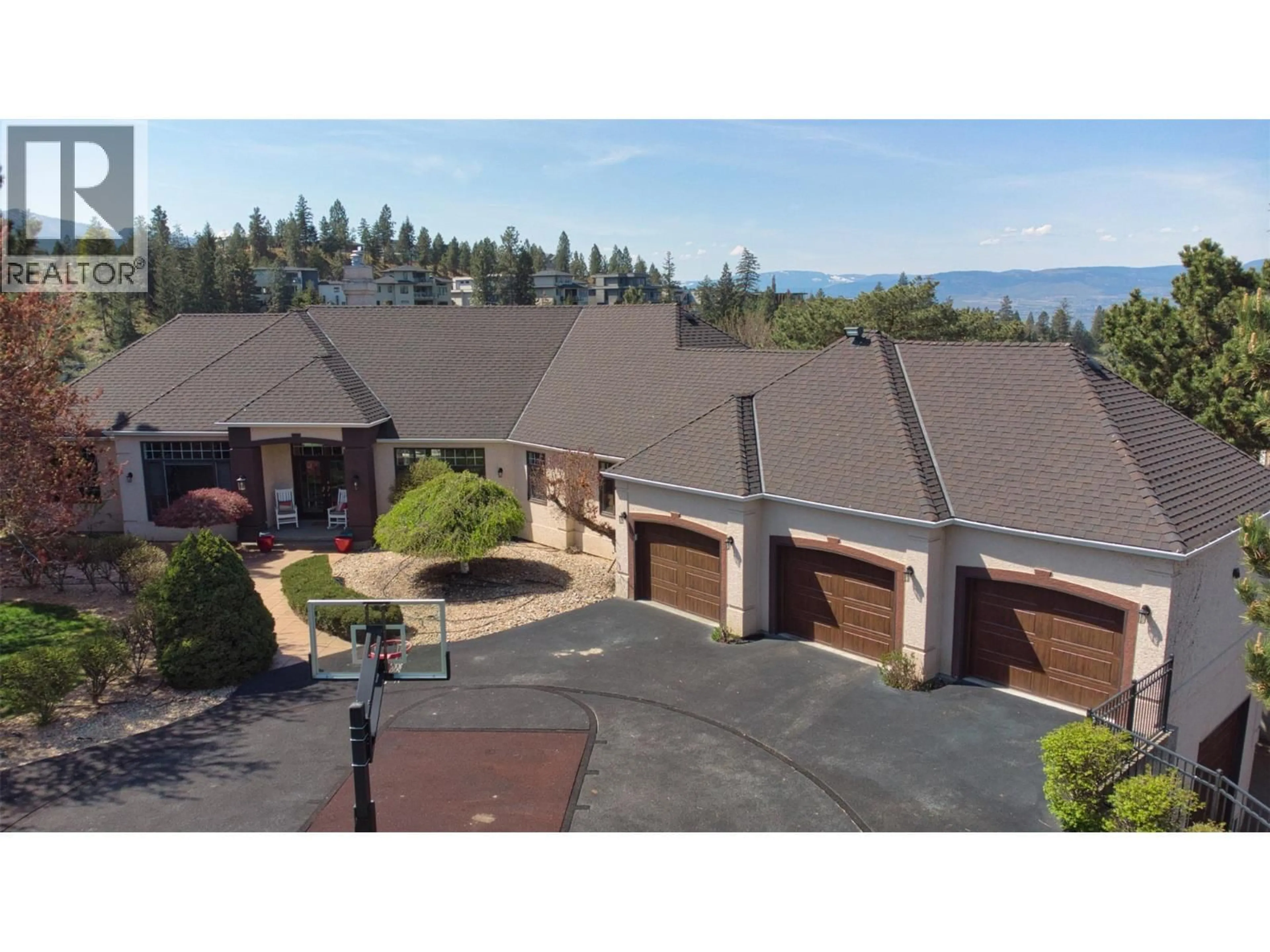 A pic from outside/outdoor area/front of a property/back of a property/a pic from drone, mountain view for 1117 CRAWFORD ROAD, Kelowna British Columbia V1Z3L7