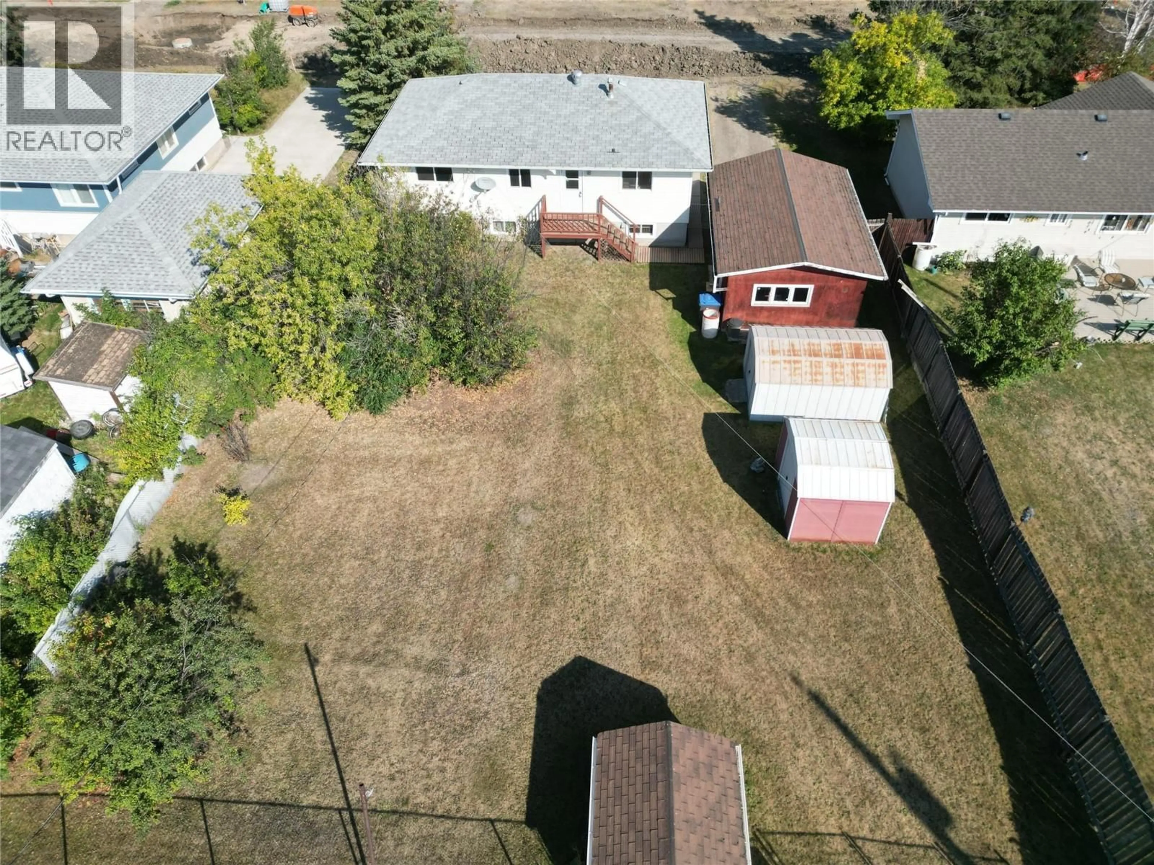 A pic from outside/outdoor area/front of a property/back of a property/a pic from drone, street for 1549 110 AVENUE, Dawson Creek British Columbia V1G2W3