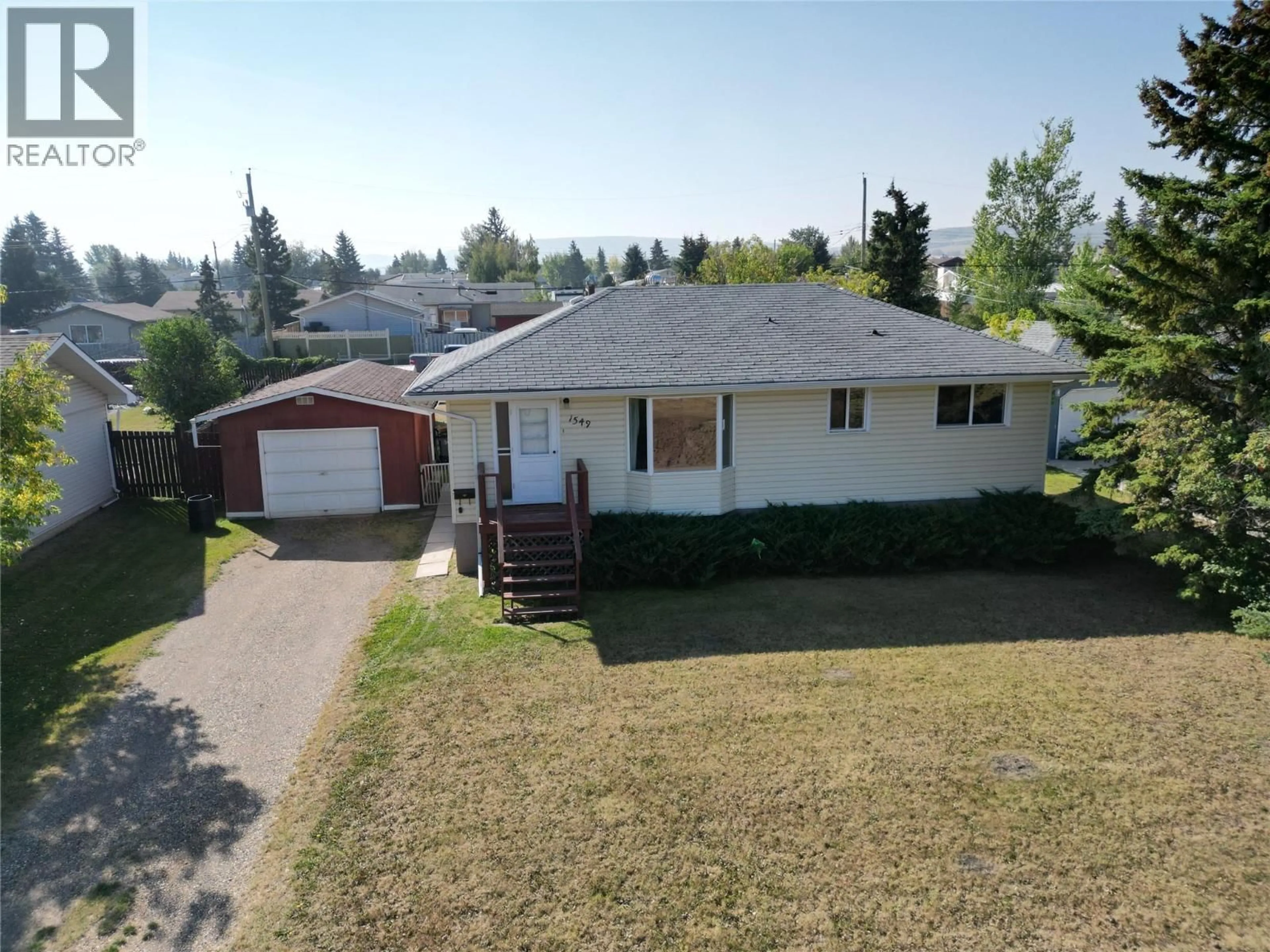 A pic from outside/outdoor area/front of a property/back of a property/a pic from drone, street for 1549 110 AVENUE, Dawson Creek British Columbia V1G2W3