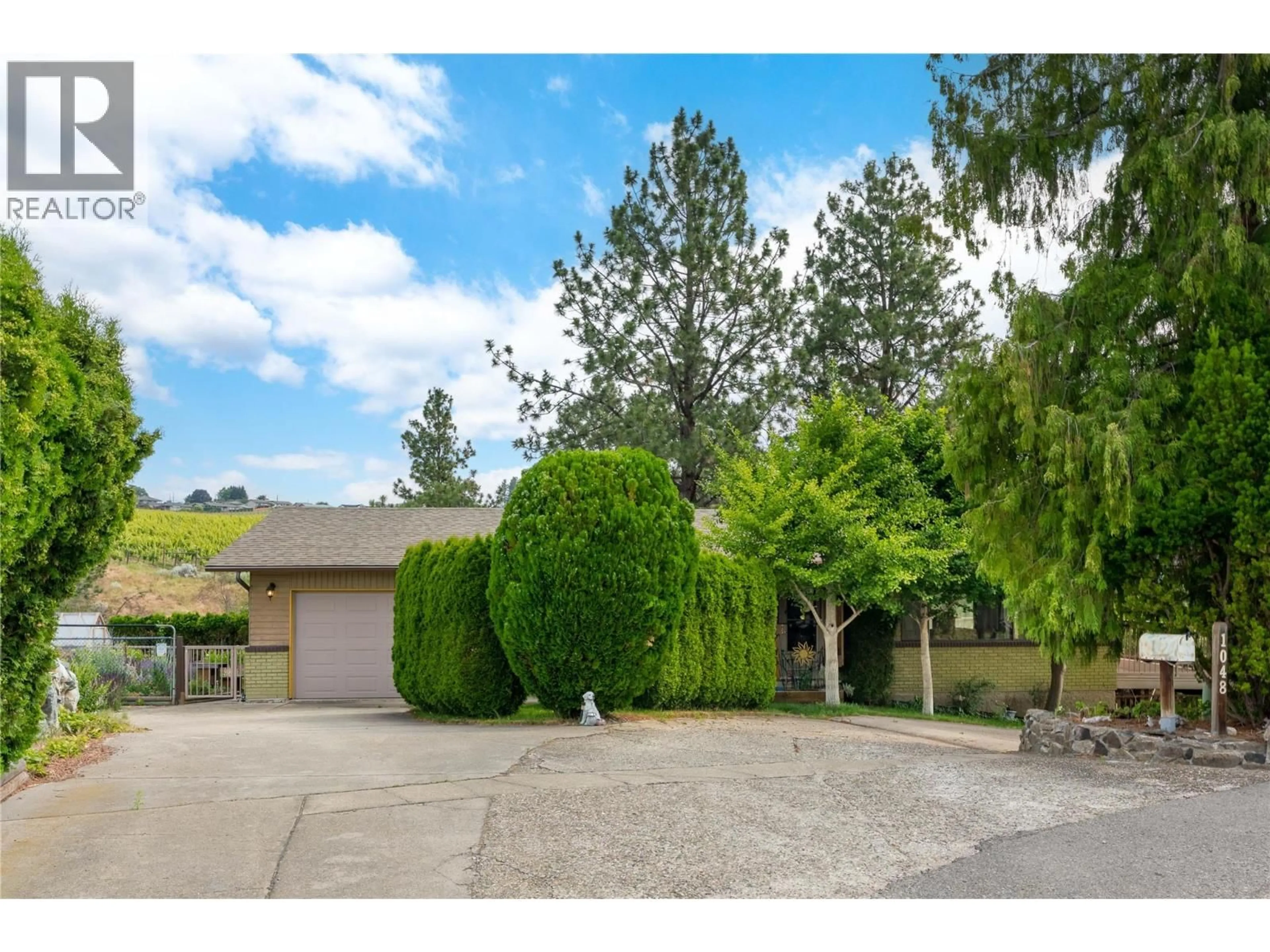 A pic from outside/outdoor area/front of a property/back of a property/a pic from drone, street for 1048 ALLISON PLACE, West Kelowna British Columbia V1Z2E2