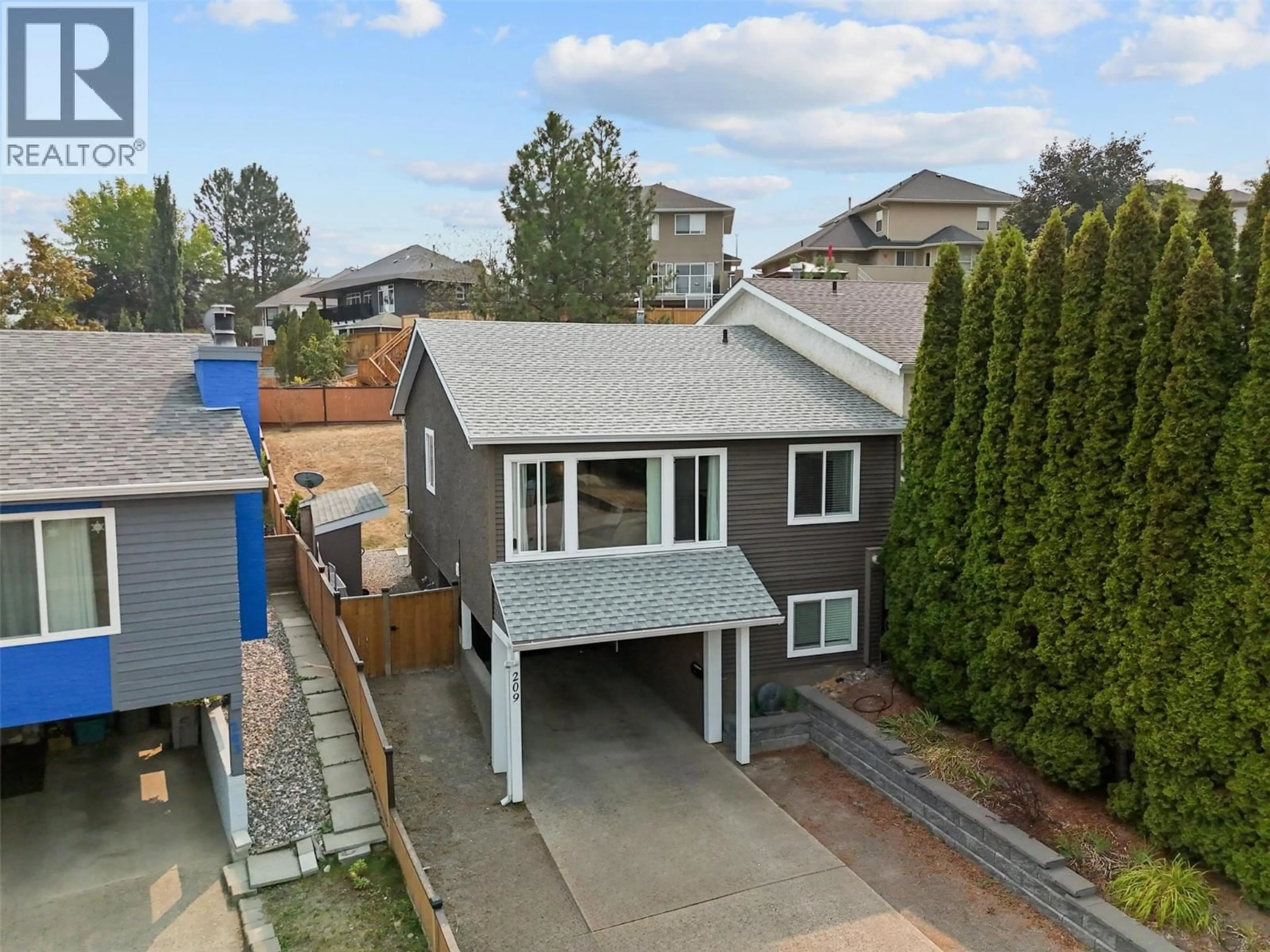 A pic from outside/outdoor area/front of a property/back of a property/a pic from drone, street for 209 HOLLYBURN DRIVE, Kamloops British Columbia V2E1Y9