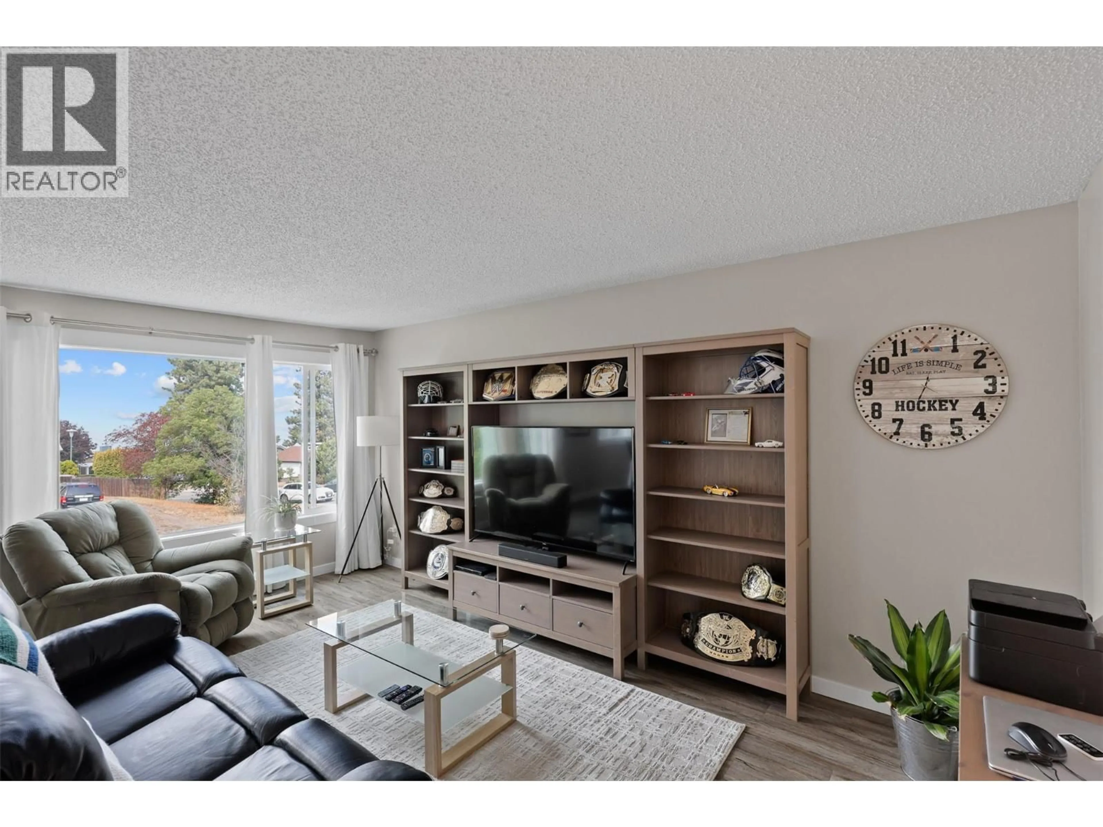 Living room with furniture, wood/laminate floor for 209 HOLLYBURN DRIVE, Kamloops British Columbia V2E1Y9