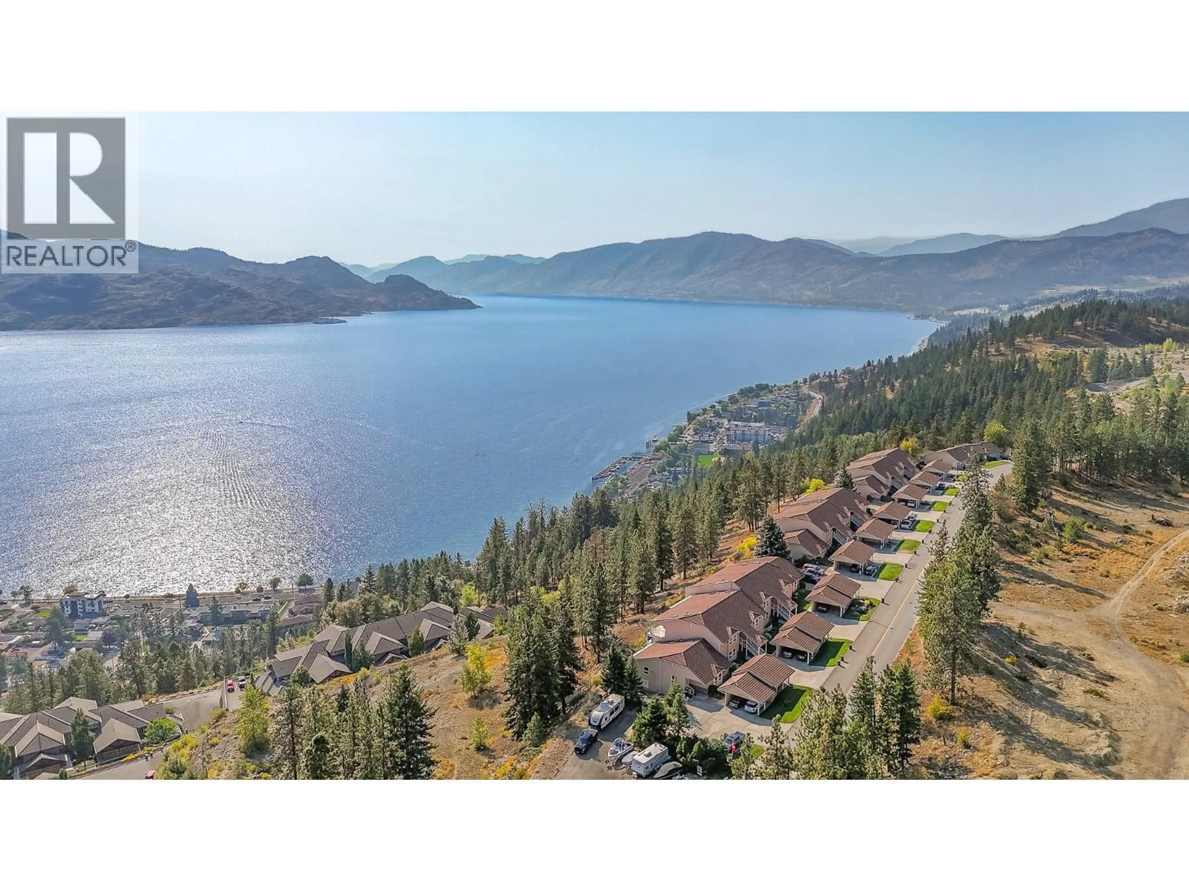 A pic from outside/outdoor area/front of a property/back of a property/a pic from drone, water/lake/river/ocean view for 105 - 4450 PONDEROSA DRIVE, Peachland British Columbia V0H1X5