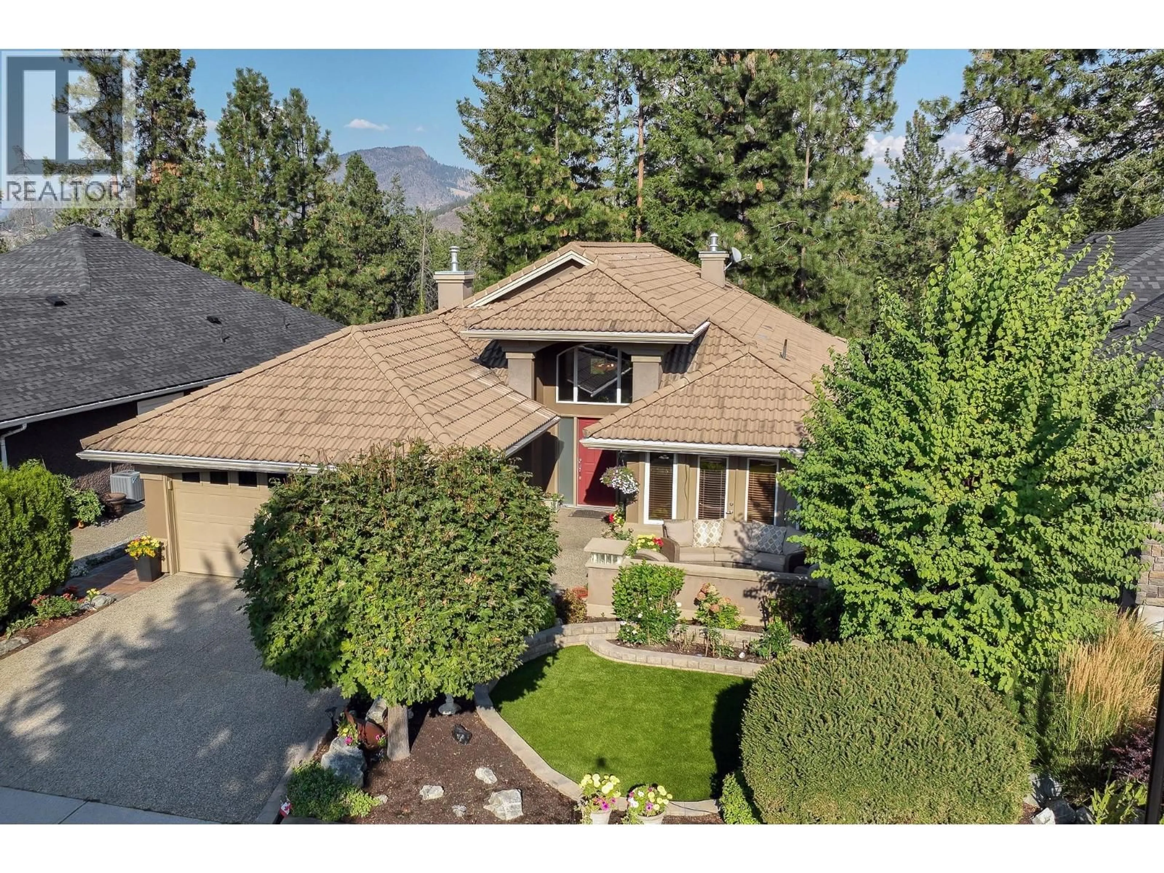 A pic from outside/outdoor area/front of a property/back of a property/a pic from drone, mountain view for 4117 GALLAGHERS BOULEVARD SOUTH, Kelowna British Columbia V1W4V2