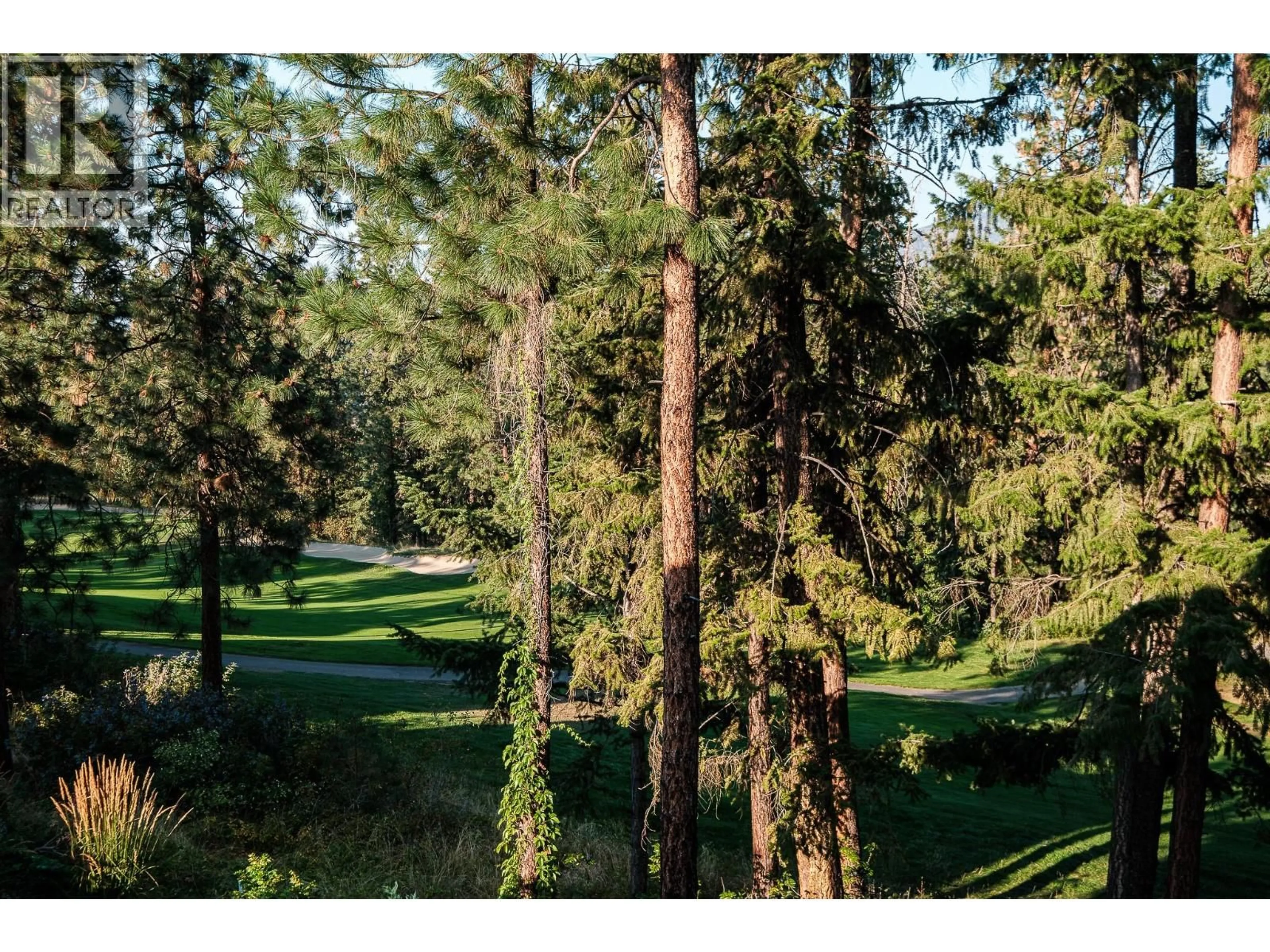A pic from outside/outdoor area/front of a property/back of a property/a pic from drone, forest/trees view for 4117 GALLAGHERS BOULEVARD SOUTH, Kelowna British Columbia V1W4V2