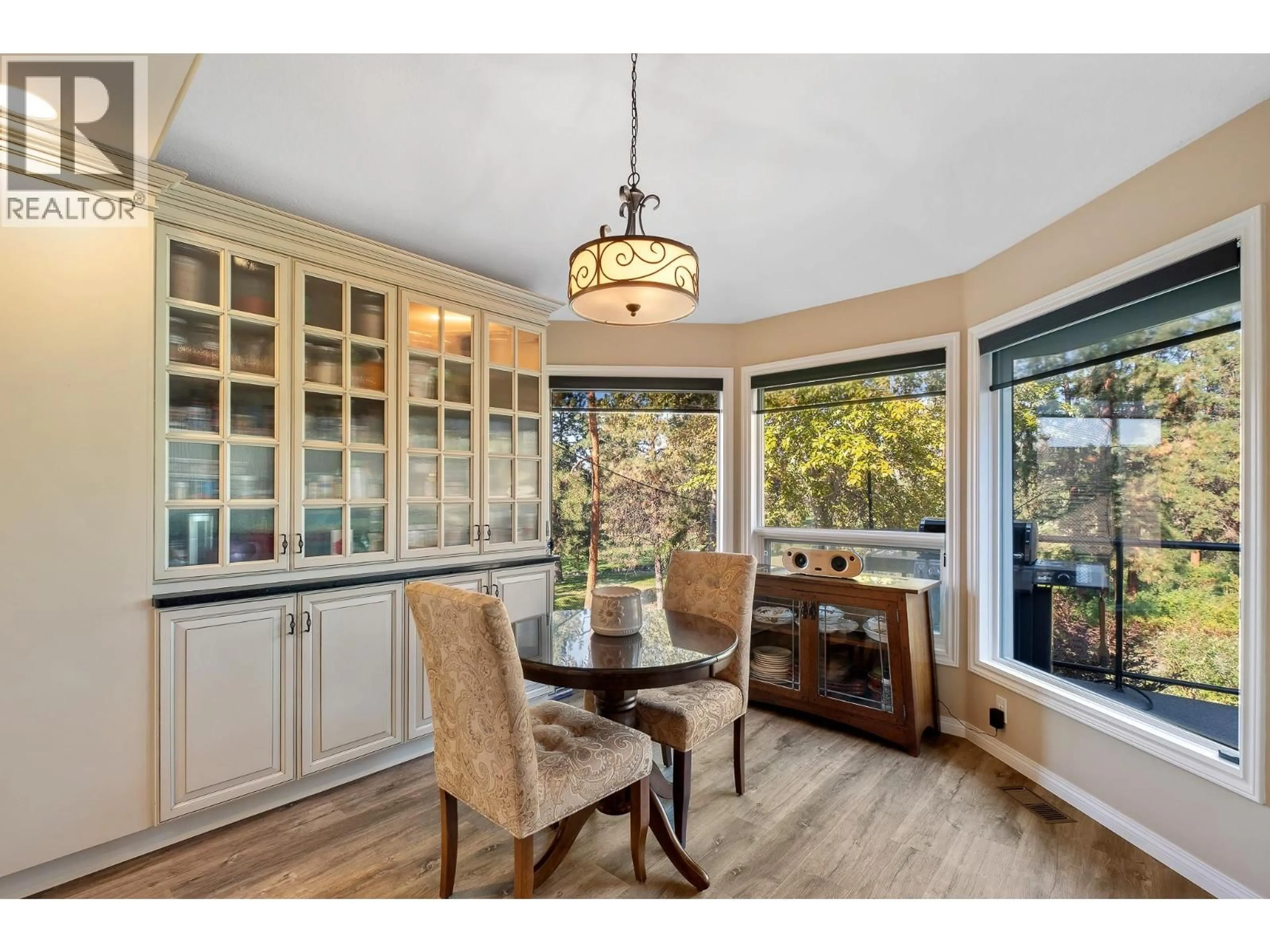 Dining room, wood/laminate floor for 3907 GALLAGHERS CIRCLE, Kelowna British Columbia V1W3Z9