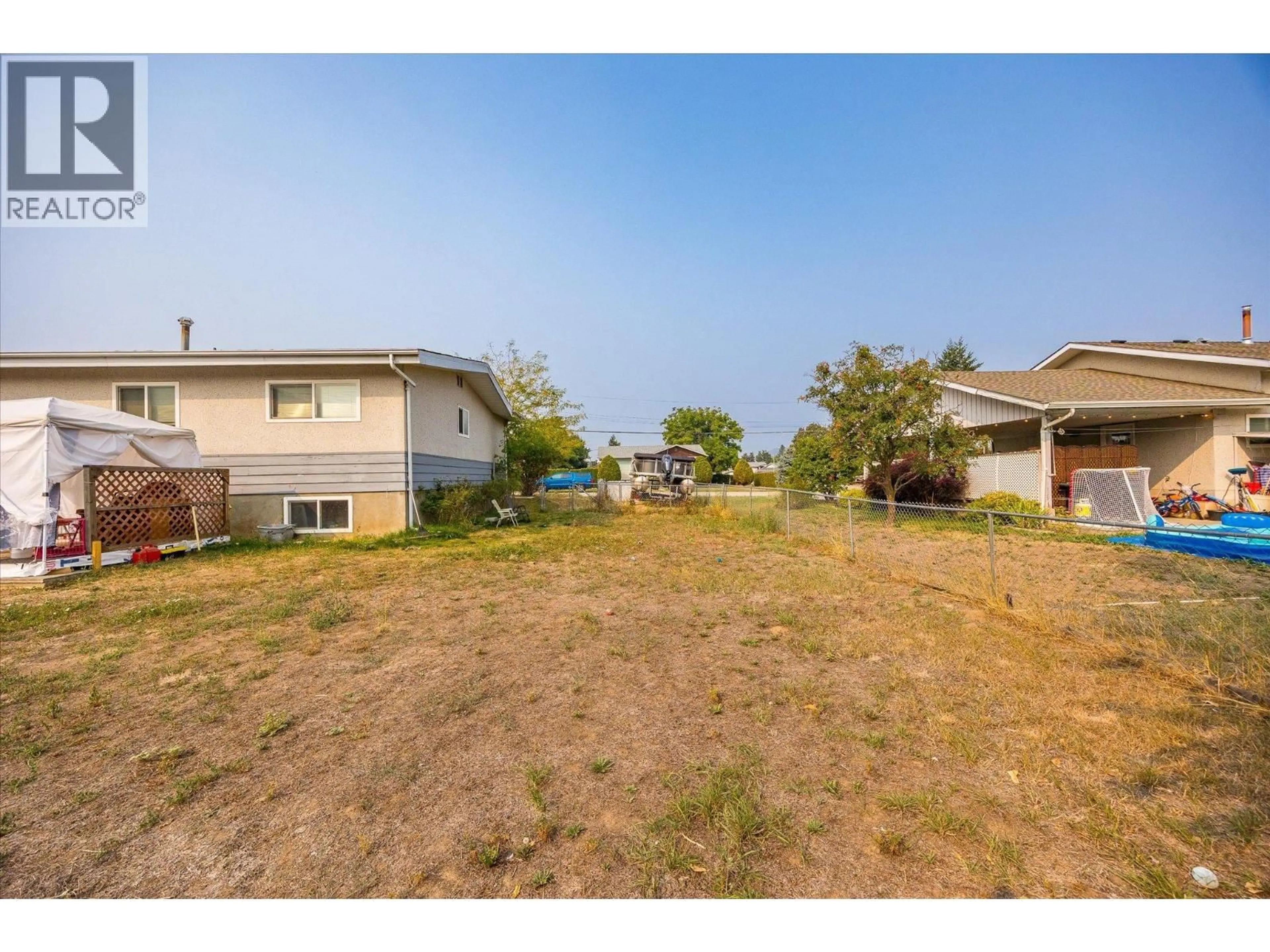 A pic from outside/outdoor area/front of a property/back of a property/a pic from drone, water/lake/river/ocean view for 155 LANGFORD ROAD, Kelowna British Columbia V1X2T7