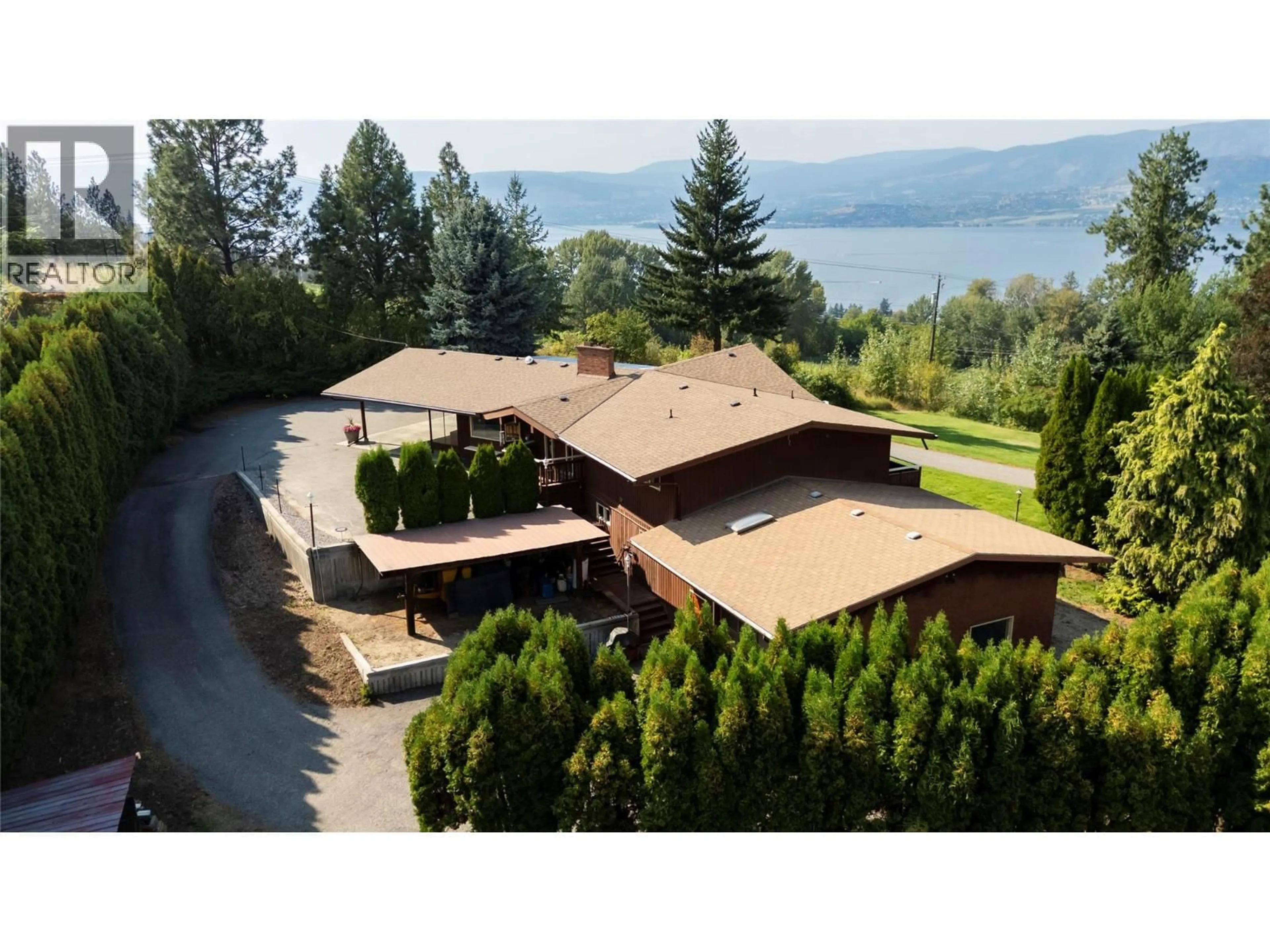 A pic from outside/outdoor area/front of a property/back of a property/a pic from drone, water/lake/river/ocean view for 4980 CHUTE LAKE ROAD, Kelowna British Columbia V1W4M3