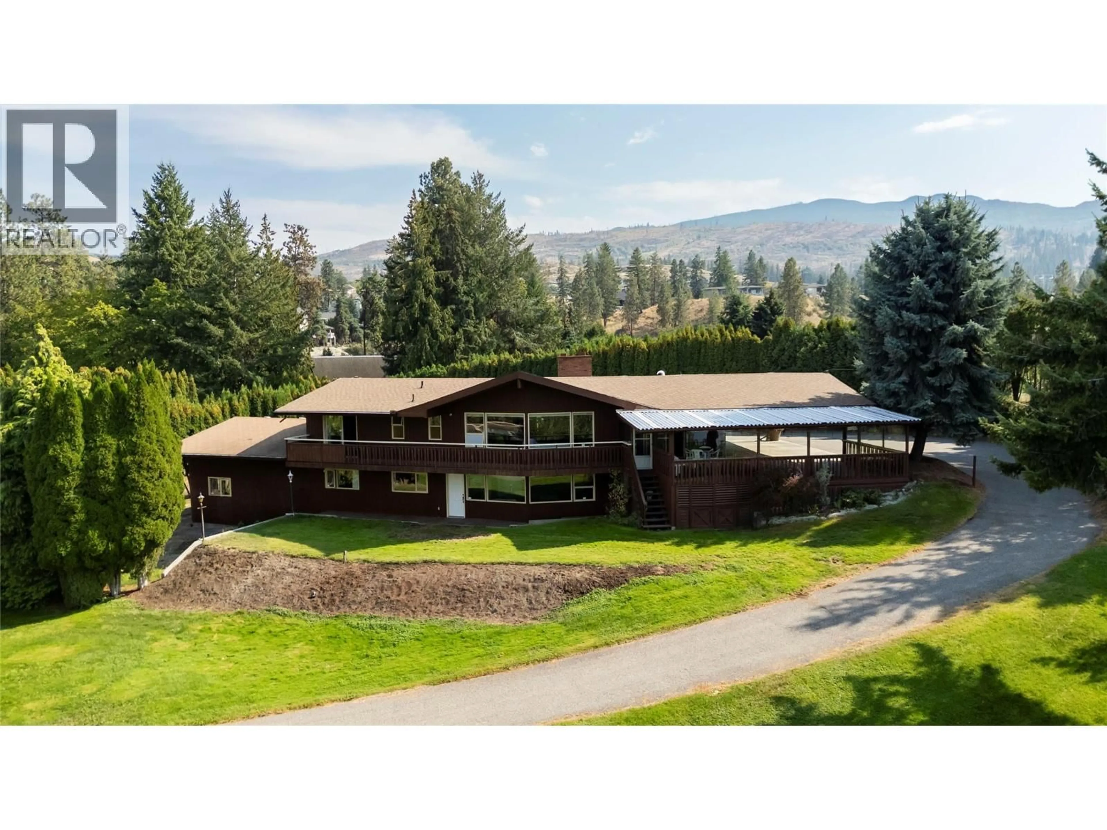 A pic from outside/outdoor area/front of a property/back of a property/a pic from drone, mountain view for 4980 CHUTE LAKE ROAD, Kelowna British Columbia V1W4M3
