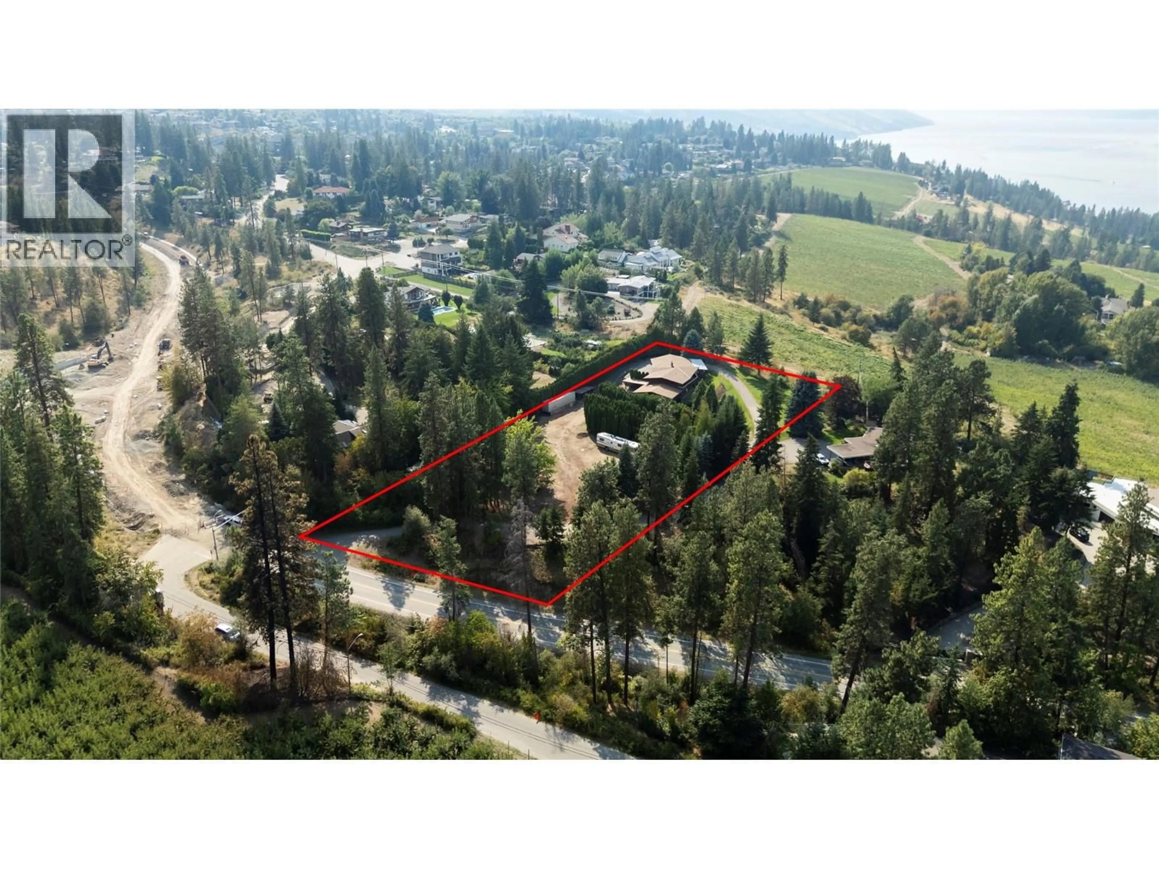 A pic from outside/outdoor area/front of a property/back of a property/a pic from drone, forest/trees view for 4980 CHUTE LAKE ROAD, Kelowna British Columbia V1W4M3