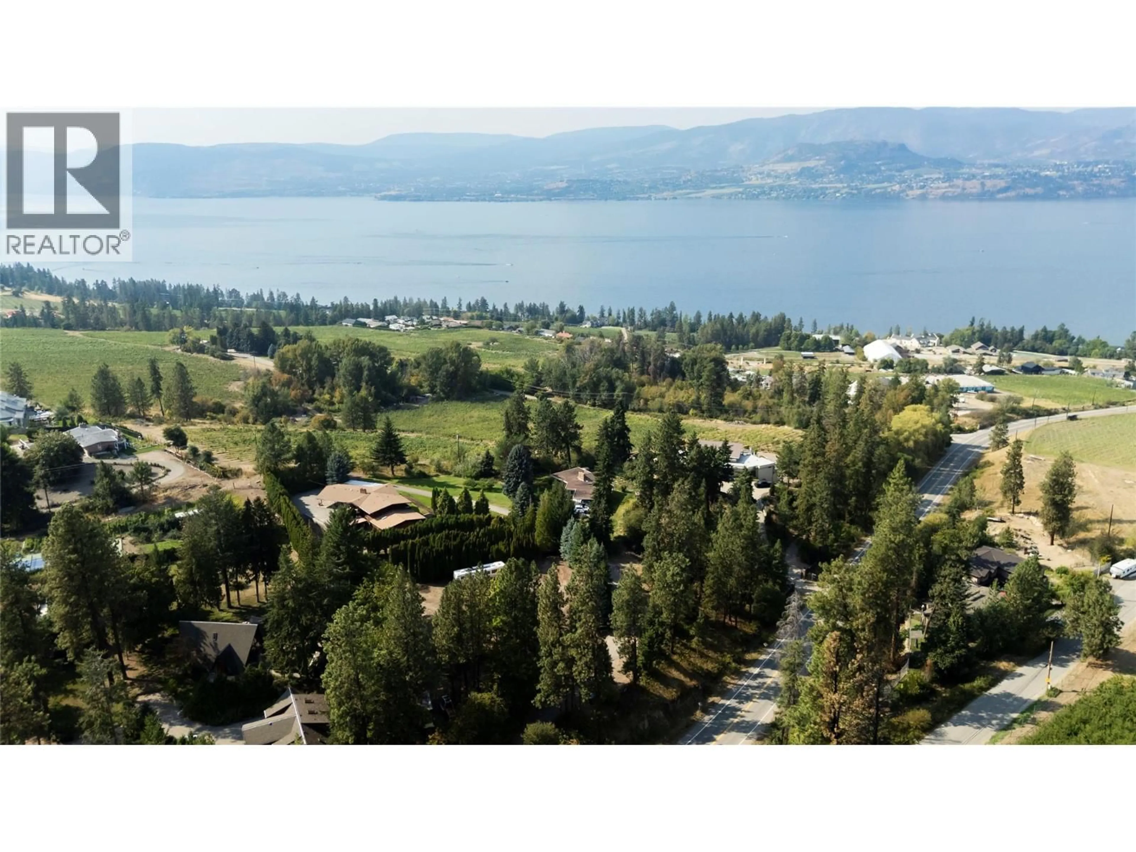 A pic from outside/outdoor area/front of a property/back of a property/a pic from drone, mountain view for 4980 CHUTE LAKE ROAD, Kelowna British Columbia V1W4M3