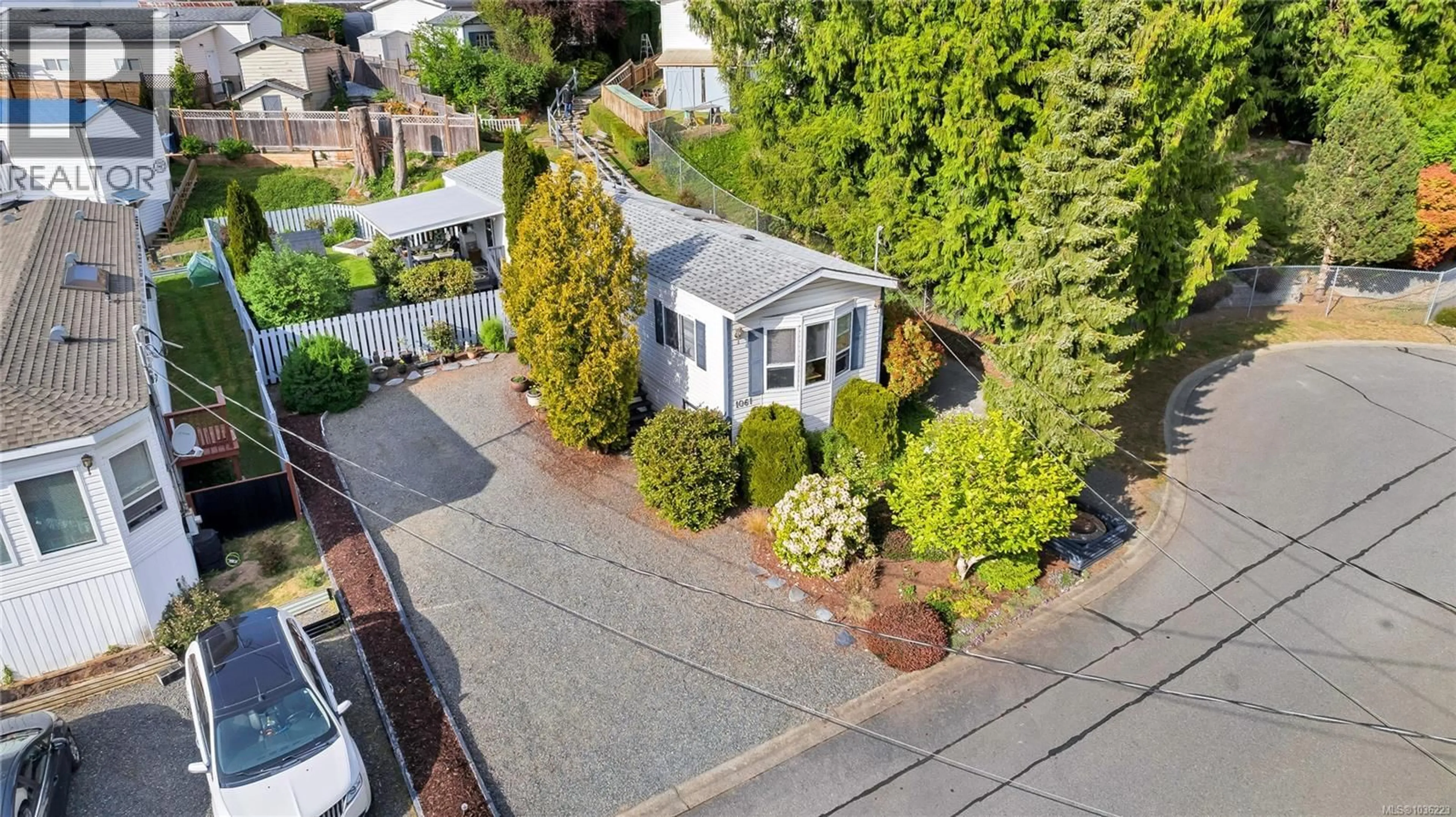 A pic from outside/outdoor area/front of a property/back of a property/a pic from drone, street for 1061 WATERMAN ROAD, Mill Bay British Columbia V0R2P0
