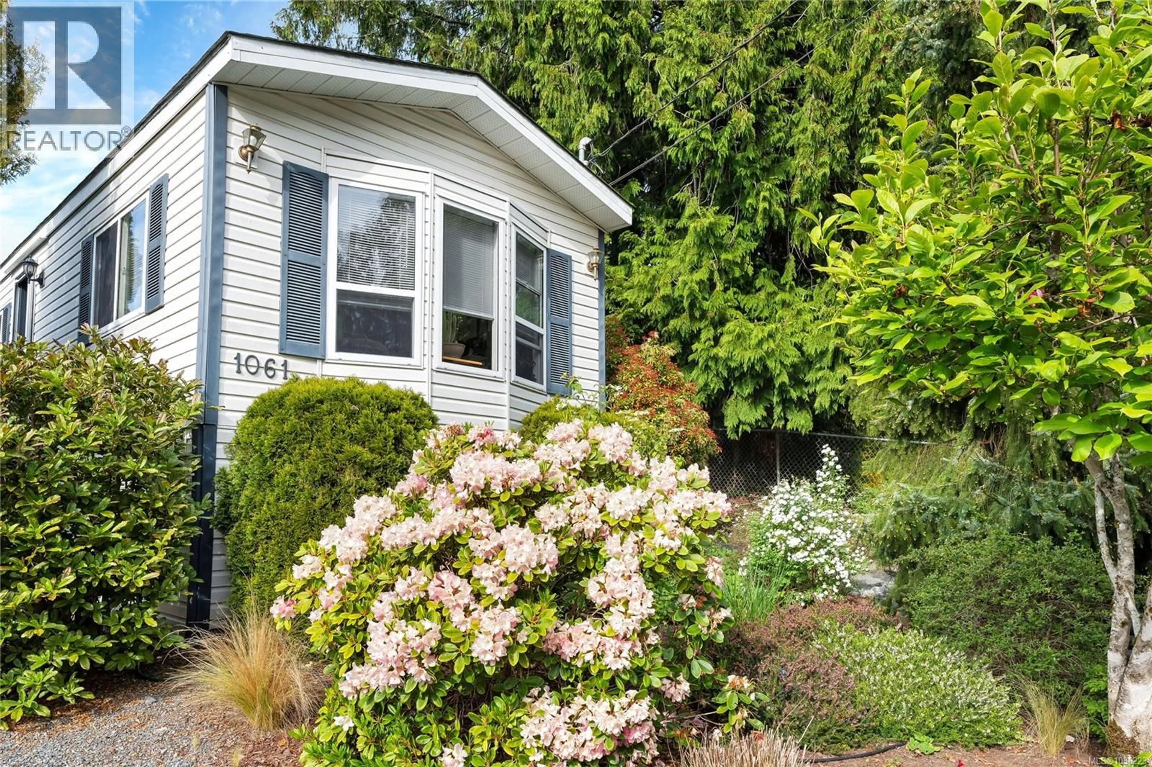 Home with vinyl exterior material, street for 1061 WATERMAN ROAD, Mill Bay British Columbia V0R2P0