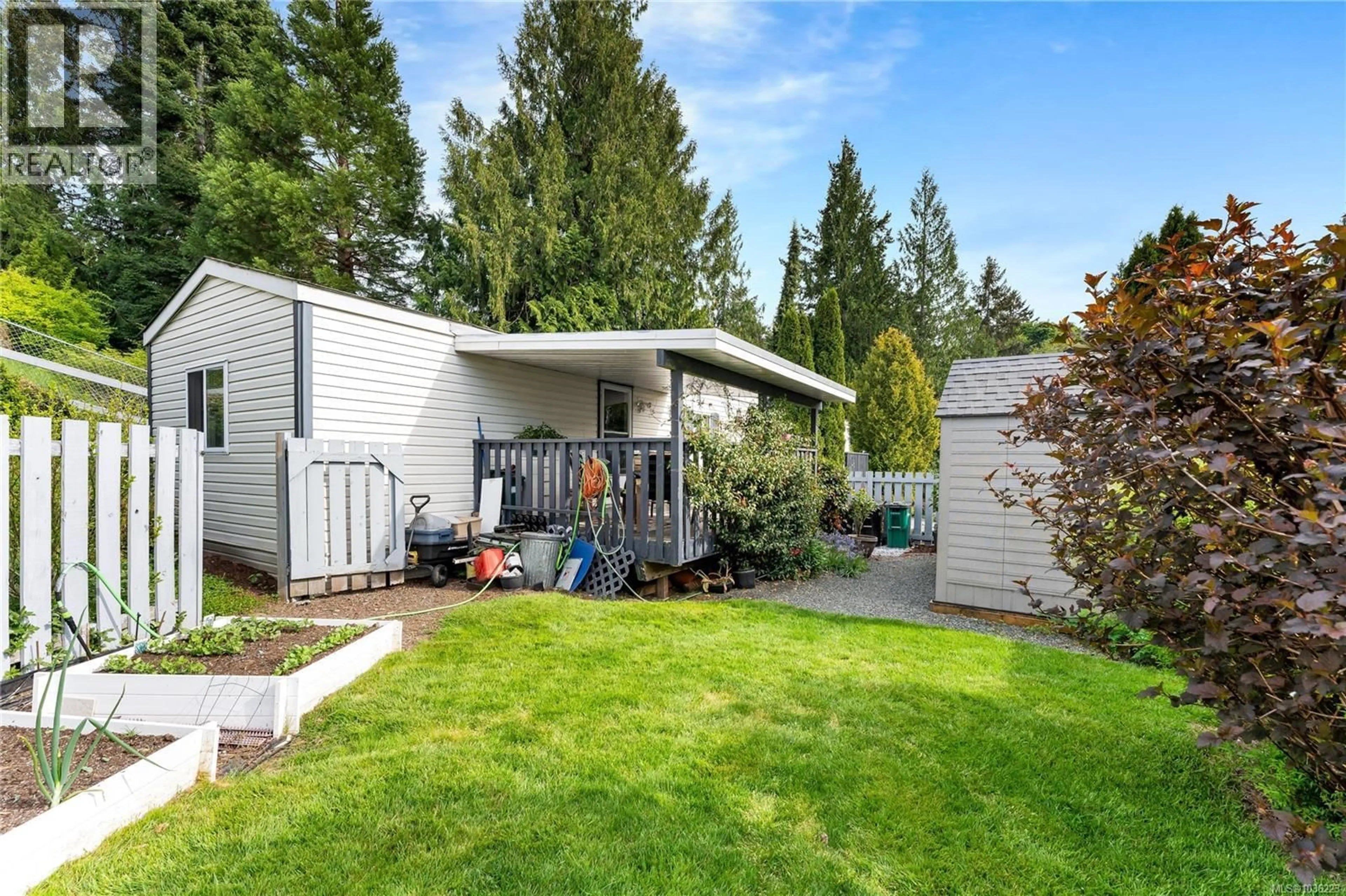 Home with vinyl exterior material, street for 1061 WATERMAN ROAD, Mill Bay British Columbia V0R2P0