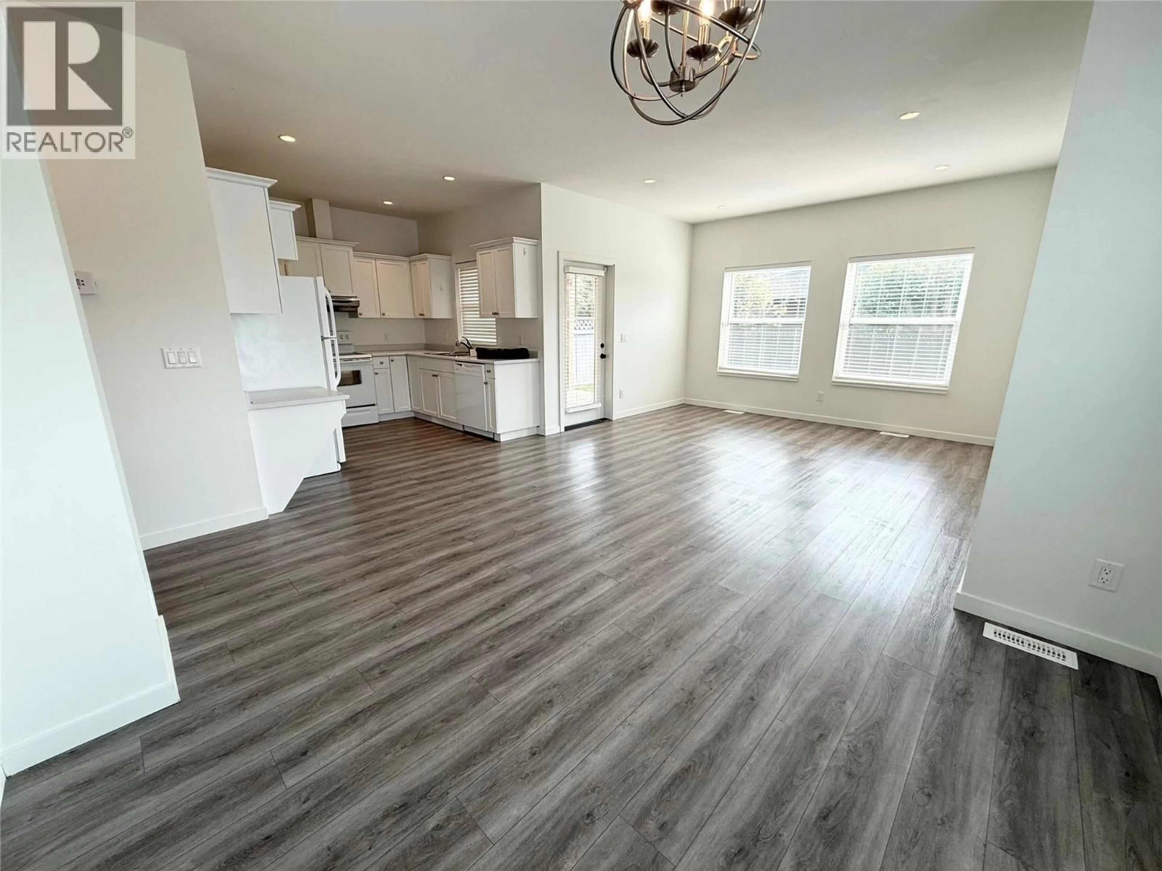 Open concept kitchen, wood/laminate floor for 1600 POPE PLACE, Merritt British Columbia V1K0B8