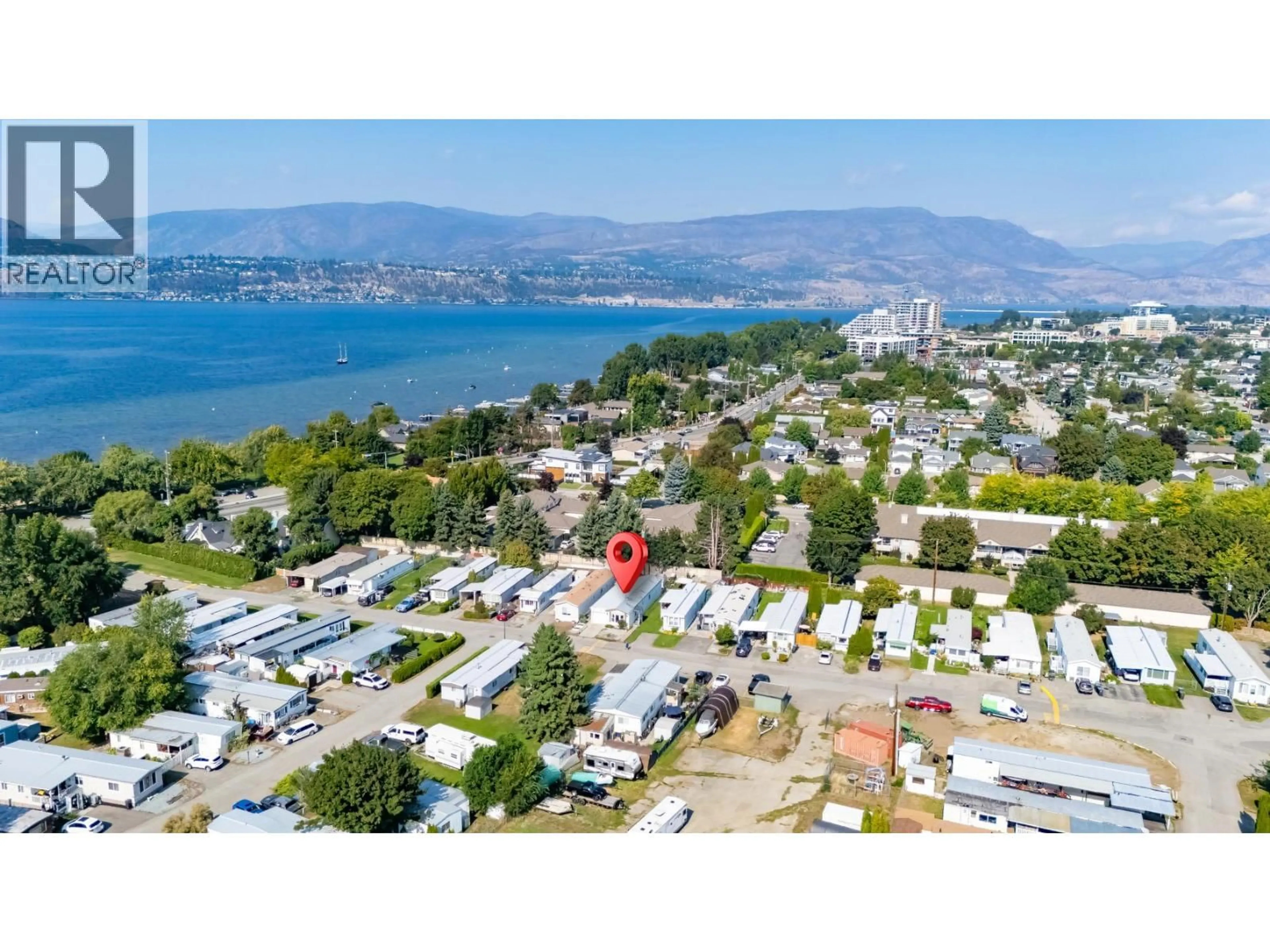 A pic from outside/outdoor area/front of a property/back of a property/a pic from drone, water/lake/river/ocean view for 8 - 3745 LAKESHORE ROAD, Kelowna British Columbia V1W3K4