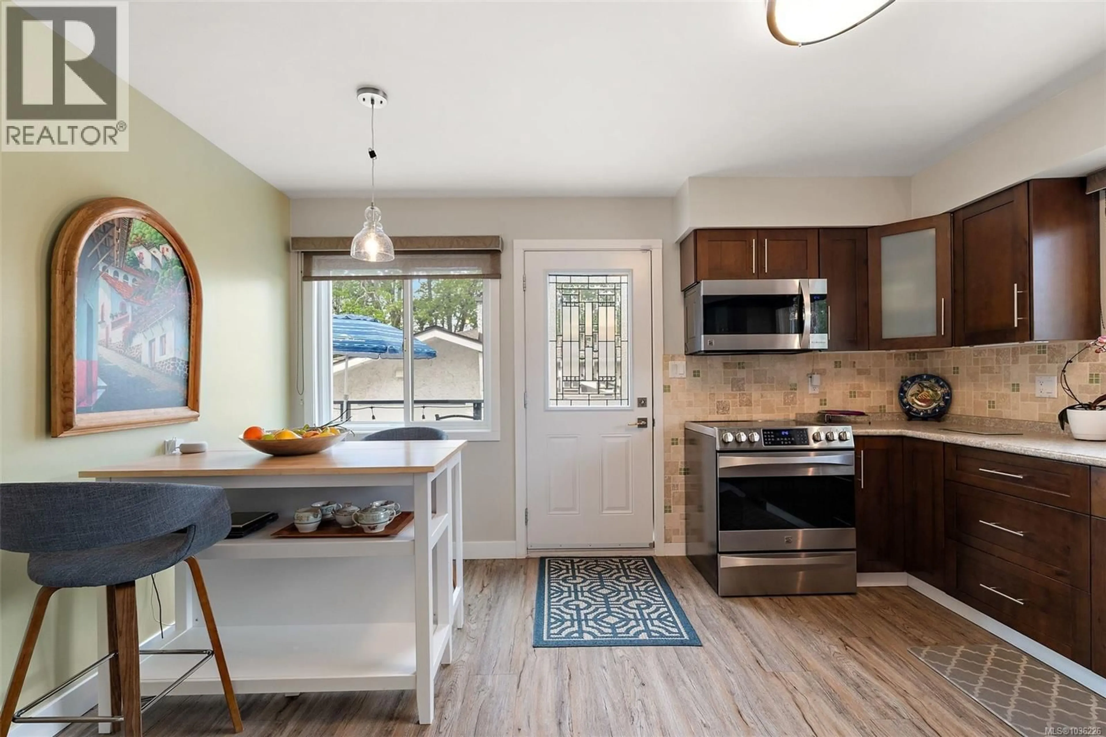 Open concept kitchen, ceramic/tile floor for 1645 SAN JUAN AVENUE, Saanich British Columbia V8N5G2