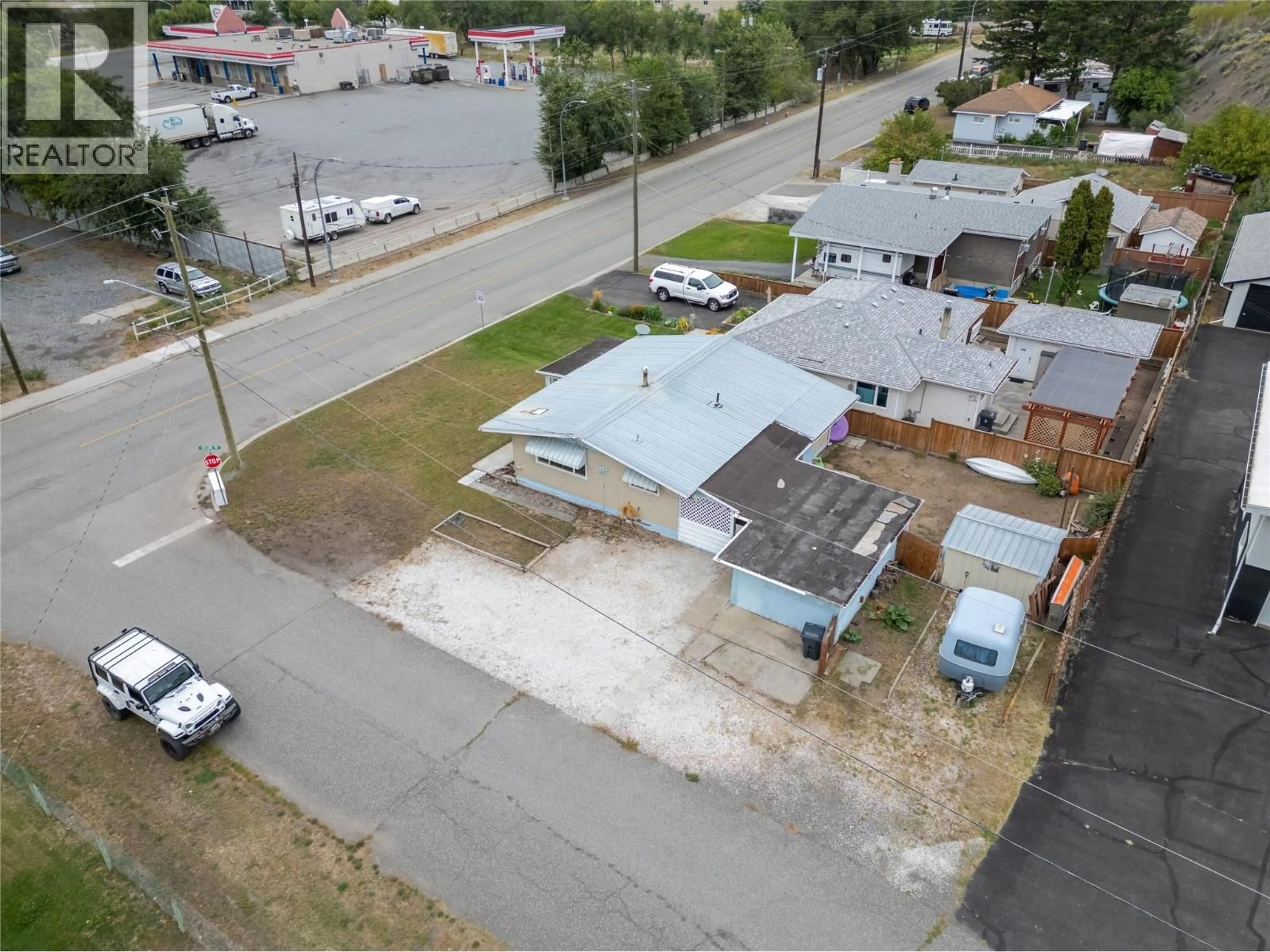 A pic from outside/outdoor area/front of a property/back of a property/a pic from drone, street for 911 COLLINS ROAD, Cache Creek British Columbia V0K1H0