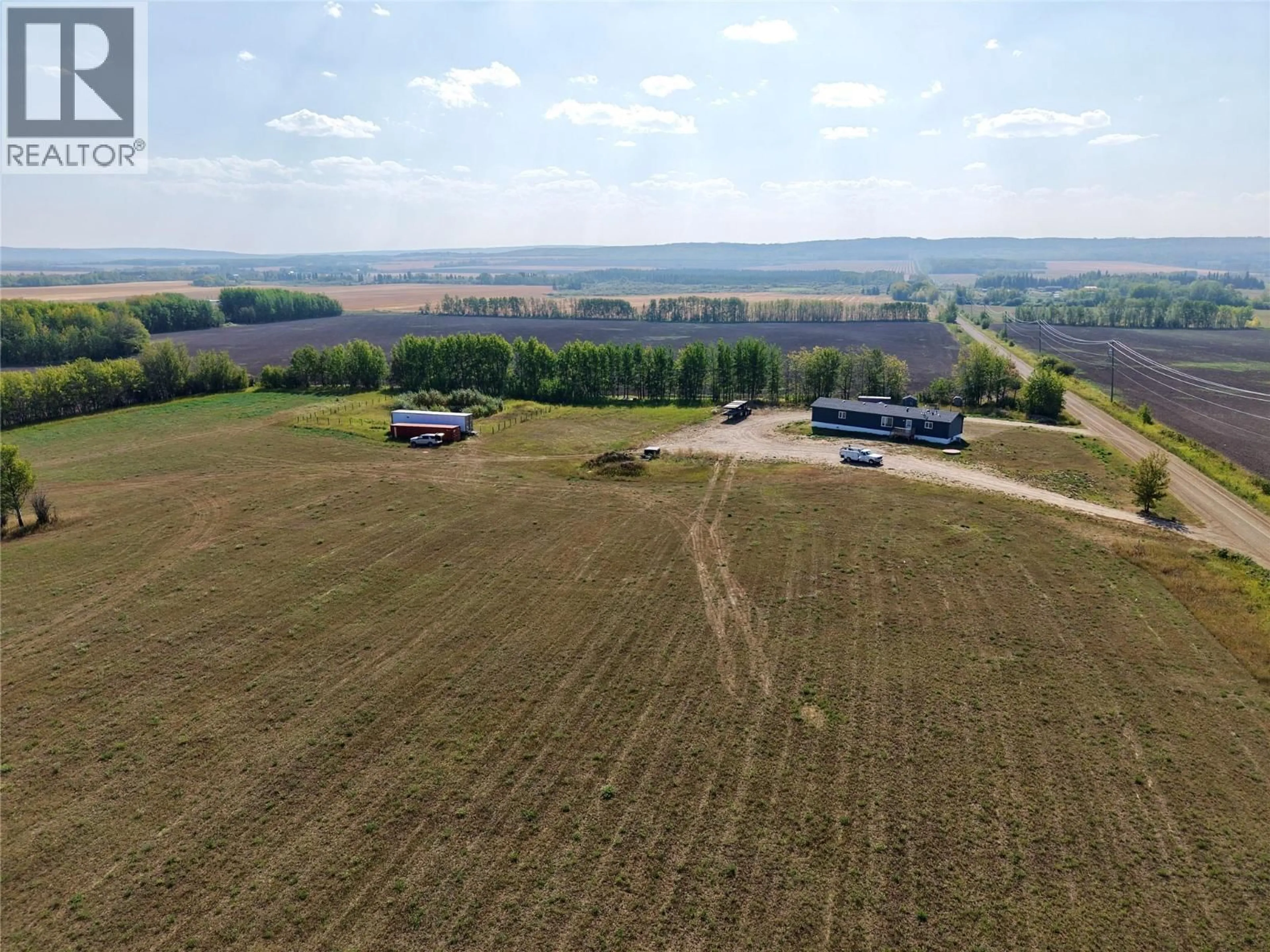 A pic from outside/outdoor area/front of a property/back of a property/a pic from drone, unknown for 15243 209 ROAD, Dawson Creek British Columbia V0C2L0