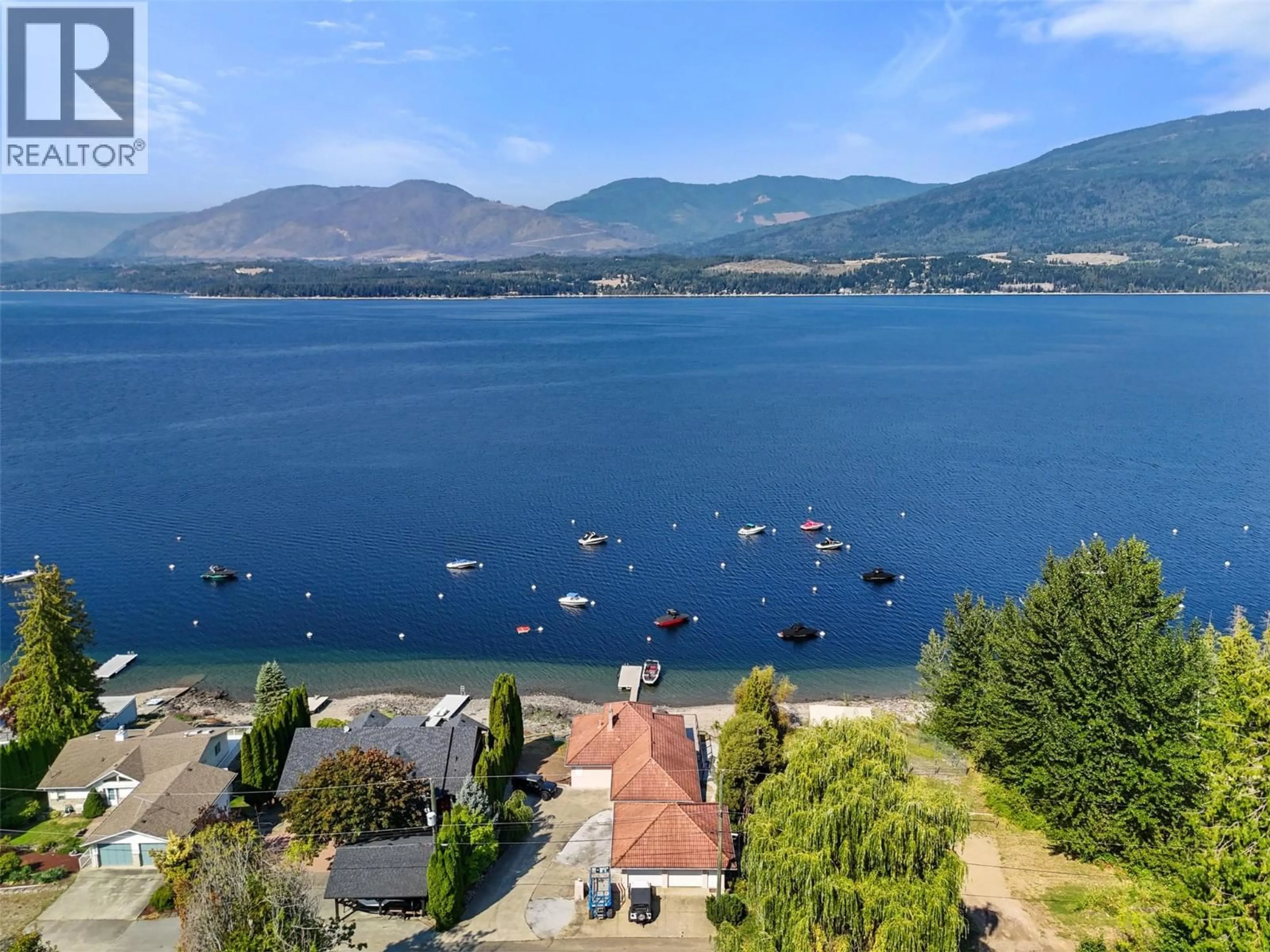 A pic from outside/outdoor area/front of a property/back of a property/a pic from drone, water/lake/river/ocean view for 4071 REID ROAD, South Shuswap British Columbia V0E1T0