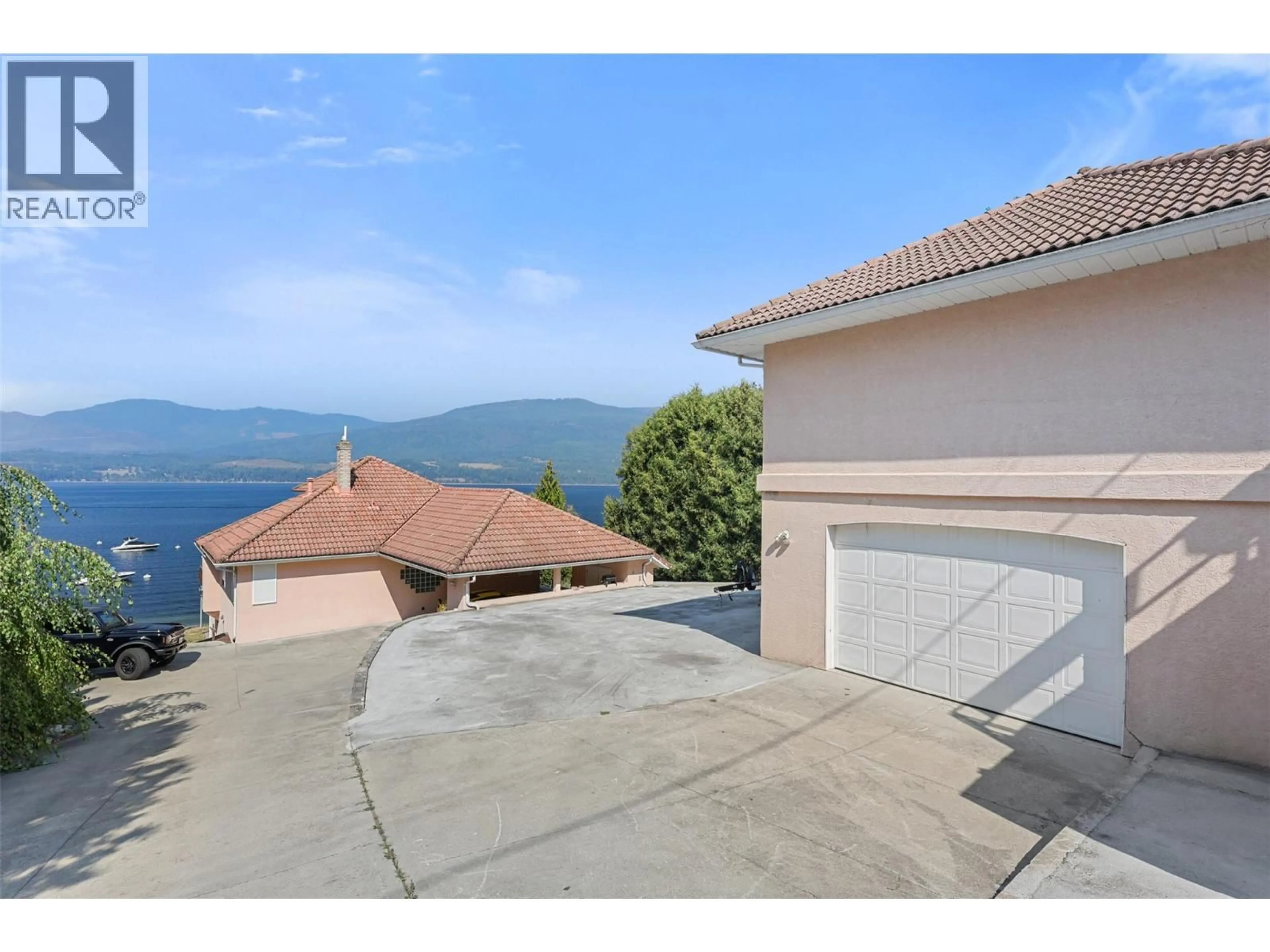 A pic from outside/outdoor area/front of a property/back of a property/a pic from drone, water/lake/river/ocean view for 4071 REID ROAD, South Shuswap British Columbia V0E1T0