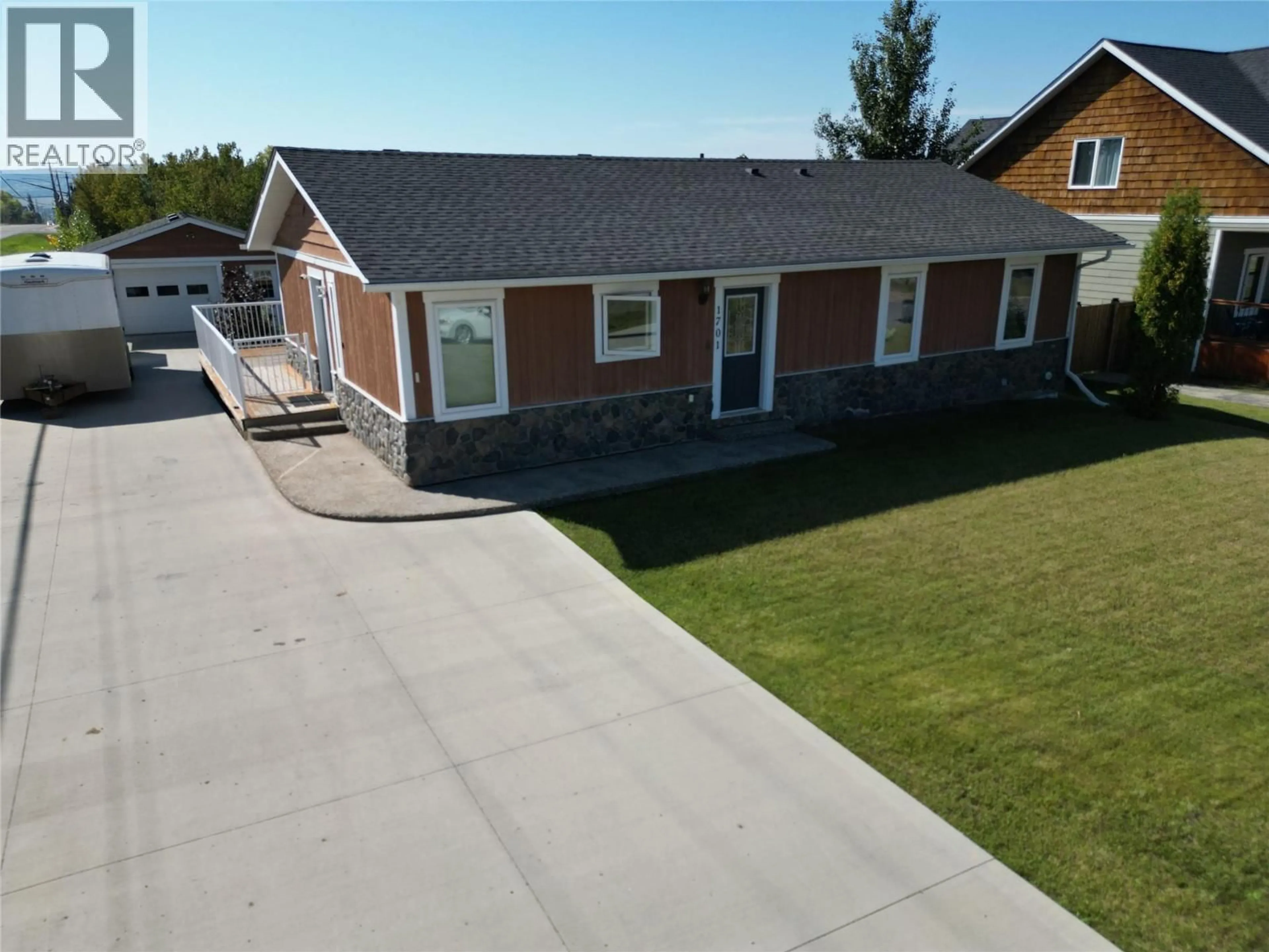 A pic from outside/outdoor area/front of a property/back of a property/a pic from drone, street for 1701 87 AVENUE, Dawson Creek British Columbia V1G0B2