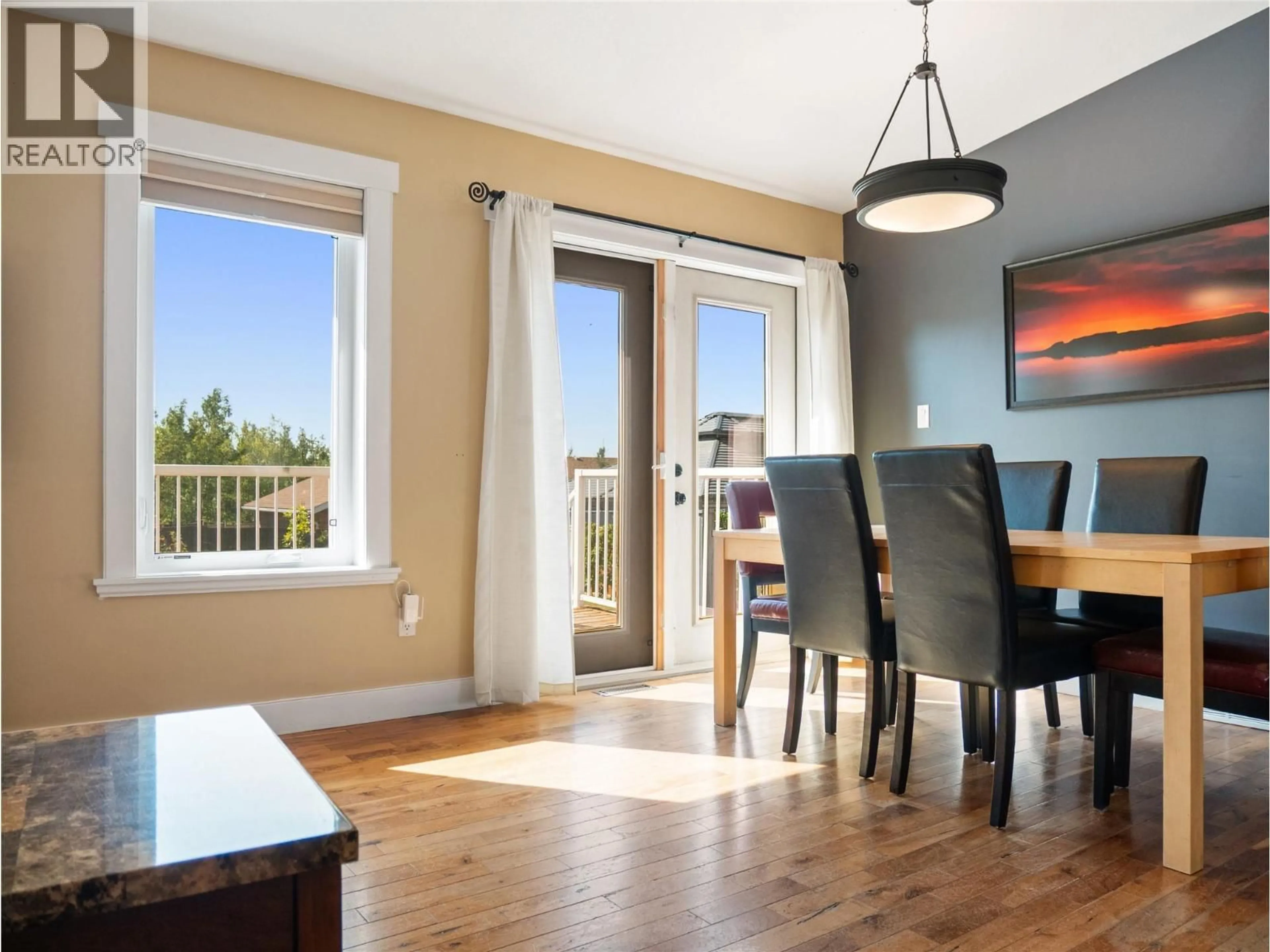 Dining room, wood/laminate floor for 1701 87 AVENUE, Dawson Creek British Columbia V1G0B2