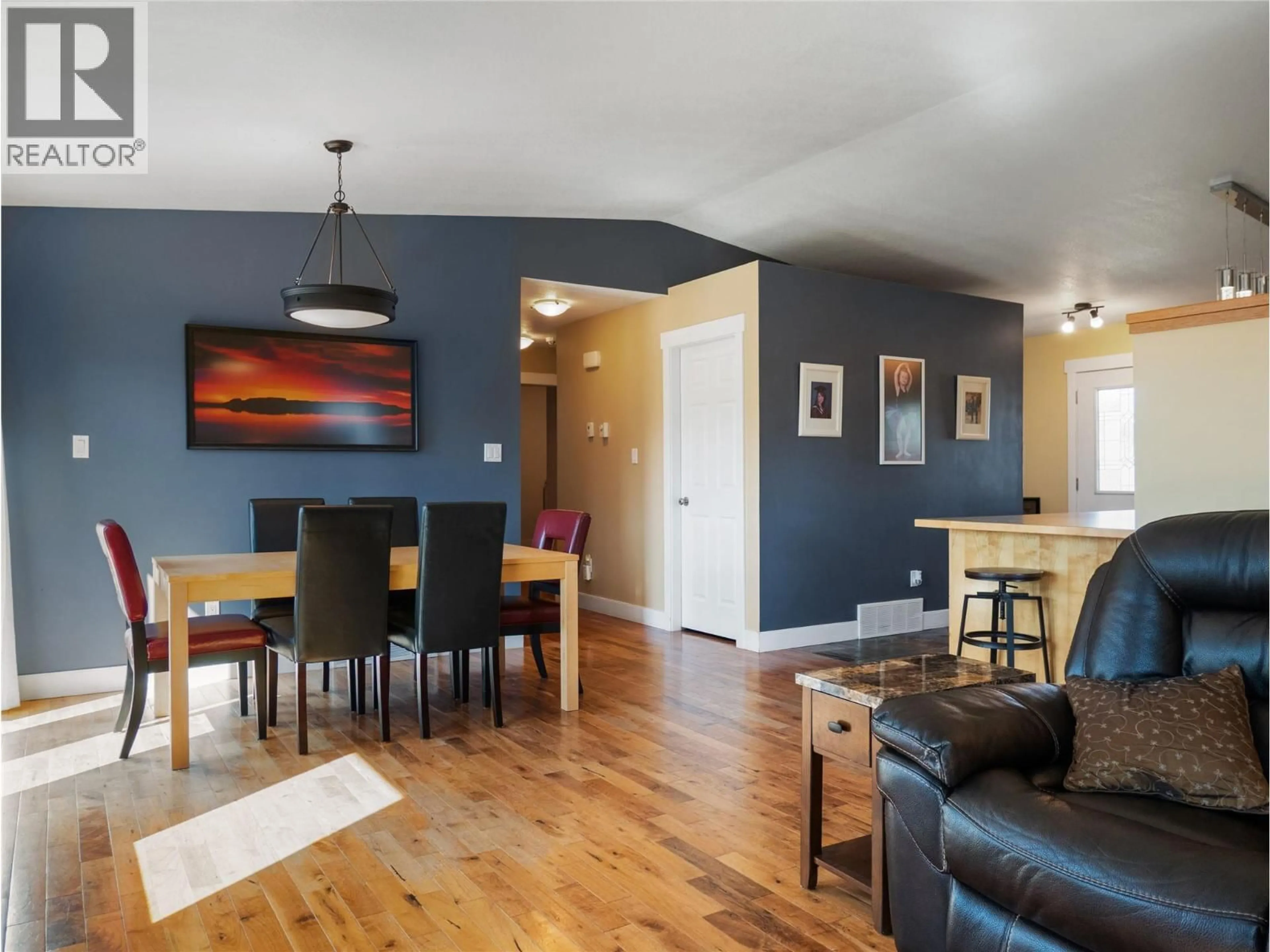 Living room with furniture, wood/laminate floor for 1701 87 AVENUE, Dawson Creek British Columbia V1G0B2