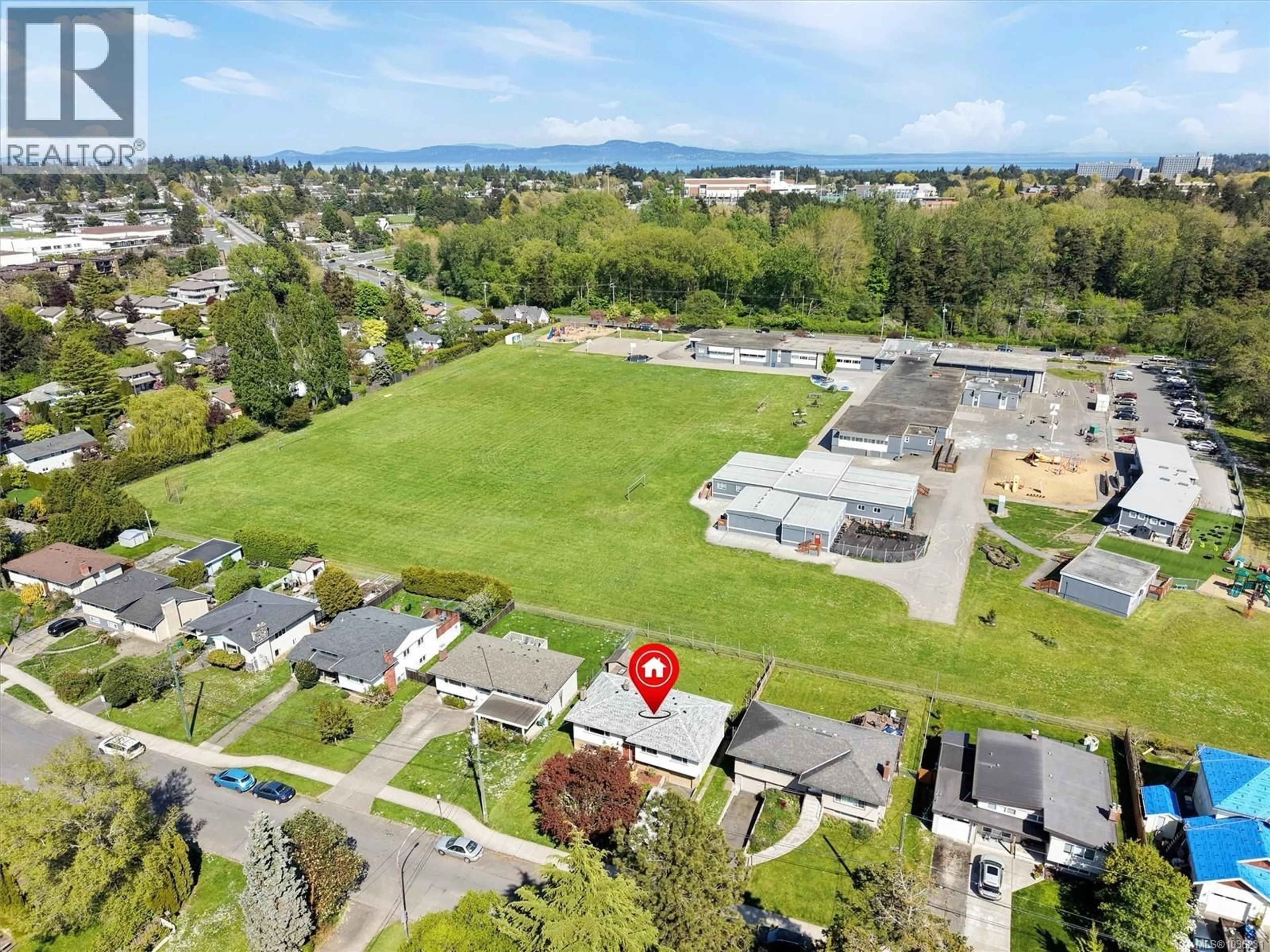 A pic from outside/outdoor area/front of a property/back of a property/a pic from drone, mountain view for 3917 ANSELL ROAD, Saanich British Columbia V8P4W1