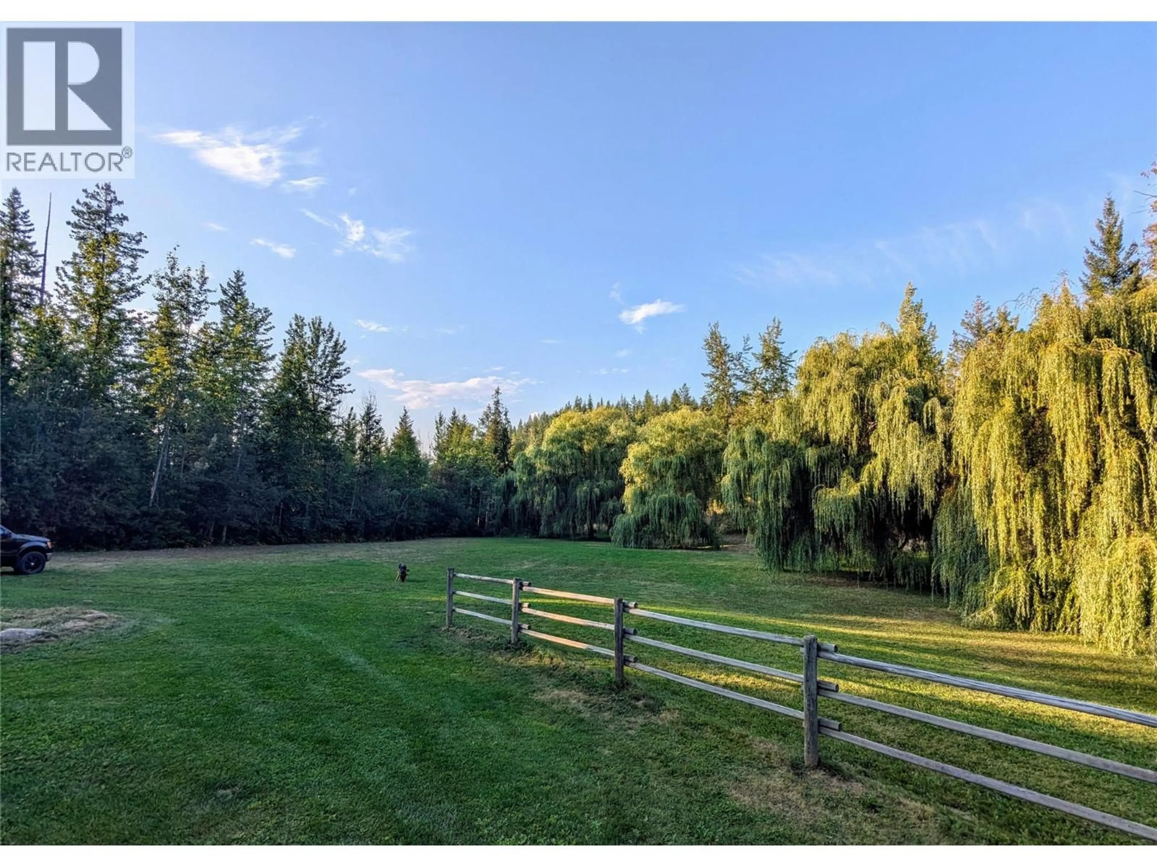 A pic from outside/outdoor area/front of a property/back of a property/a pic from drone, forest/trees view for 5060 TATLOW ROAD, Salmon Arm British Columbia V1E2P8