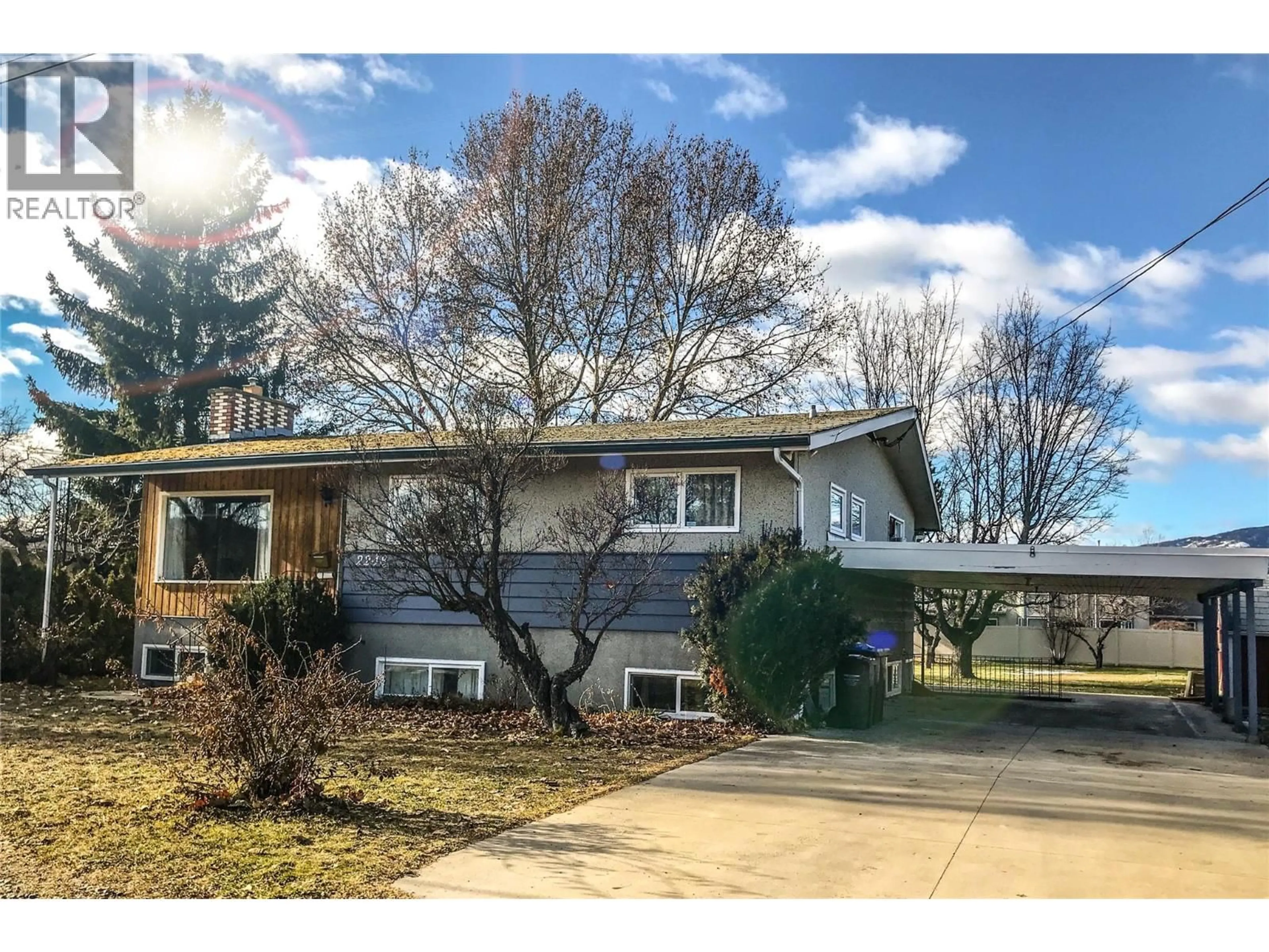 Home with vinyl exterior material, street for 2248 STILLINGFLEET ROAD, Kelowna British Columbia V1Y7Y9