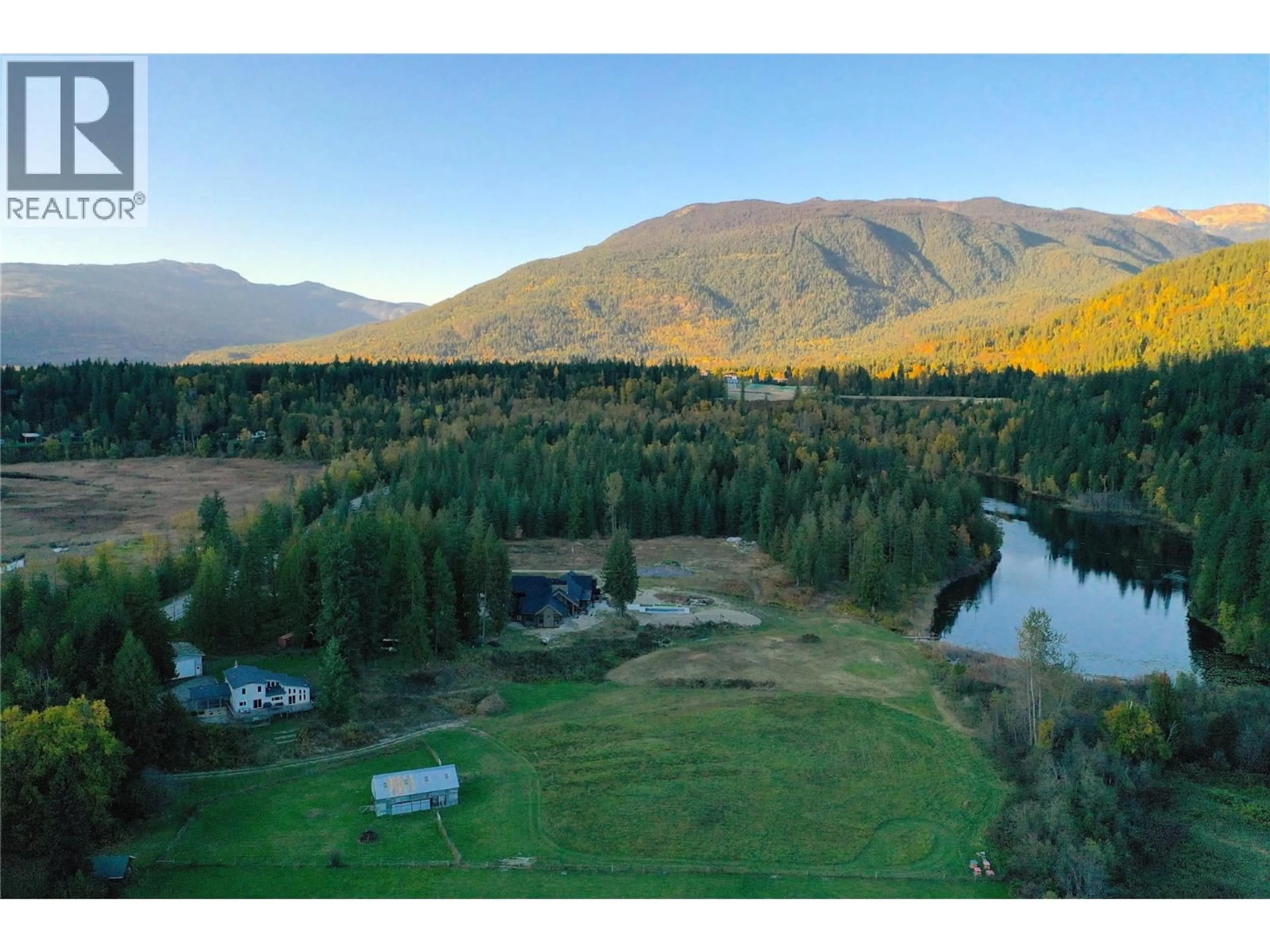 A pic from outside/outdoor area/front of a property/back of a property/a pic from drone, mountain view for 2626 AIRPORT WAY, Revelstoke British Columbia V0E2S3