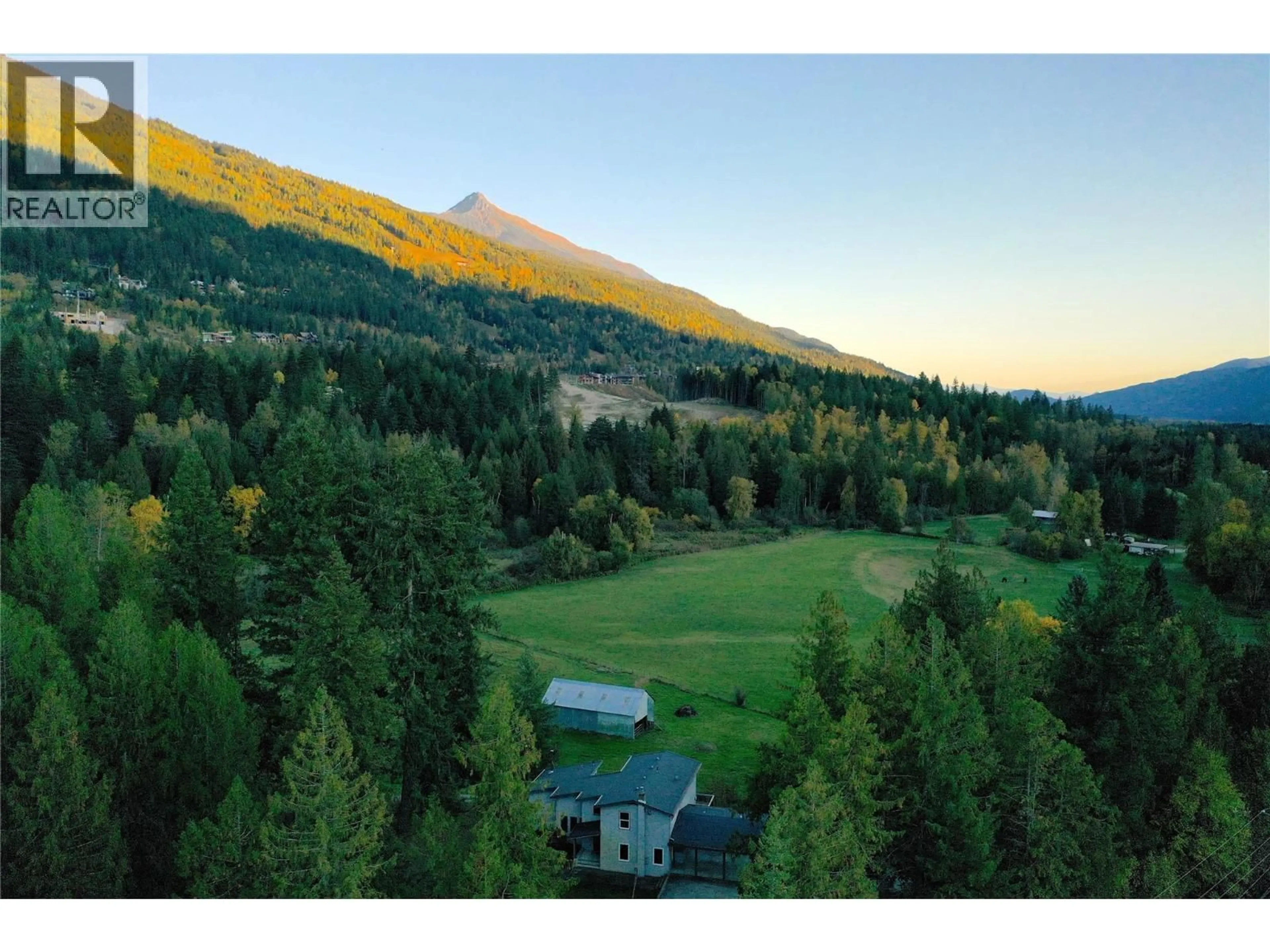 A pic from outside/outdoor area/front of a property/back of a property/a pic from drone, mountain view for 2626 AIRPORT WAY, Revelstoke British Columbia V0E2S3