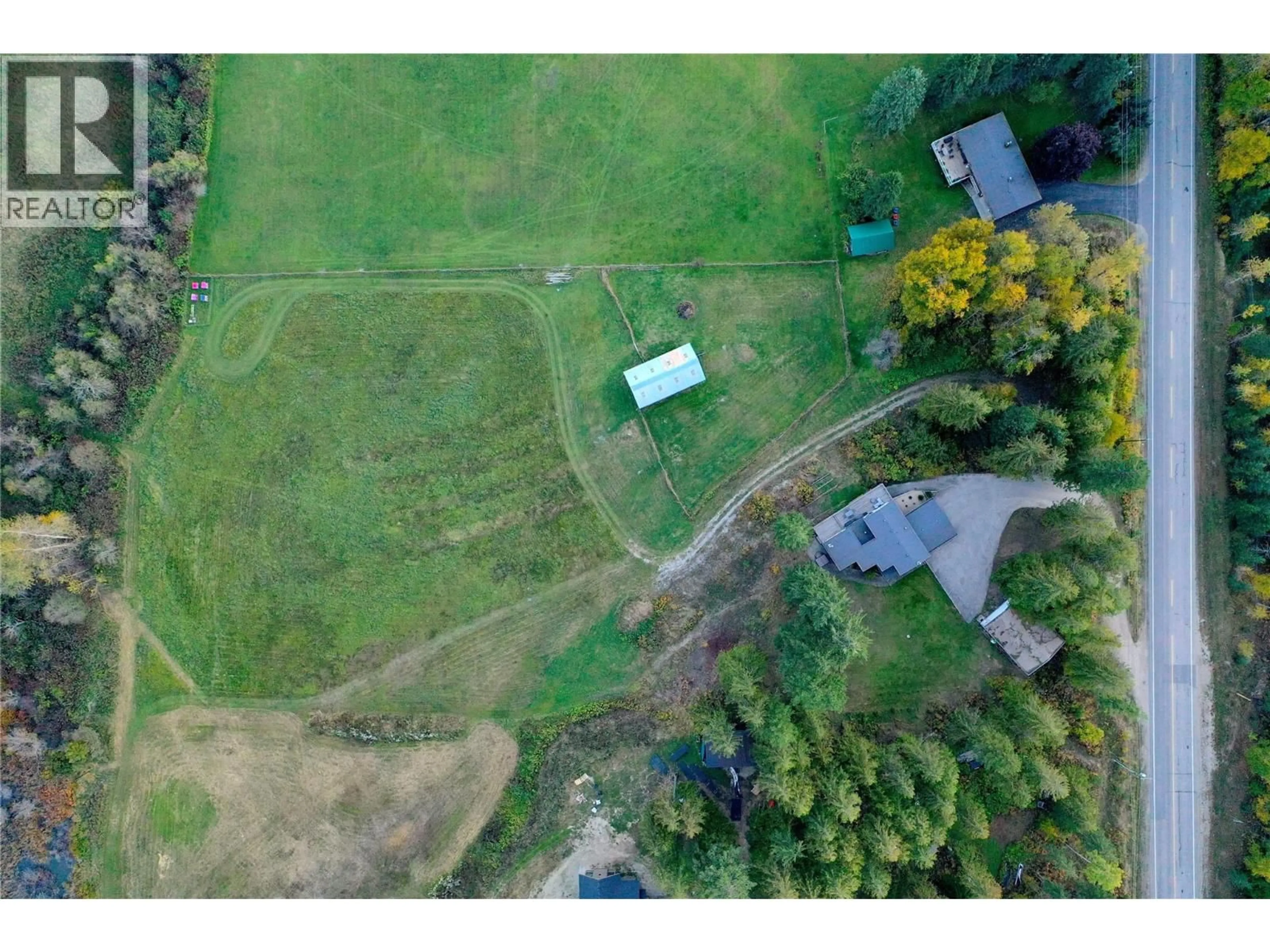 A pic from outside/outdoor area/front of a property/back of a property/a pic from drone, mountain view for 2626 AIRPORT WAY, Revelstoke British Columbia V0E2S3