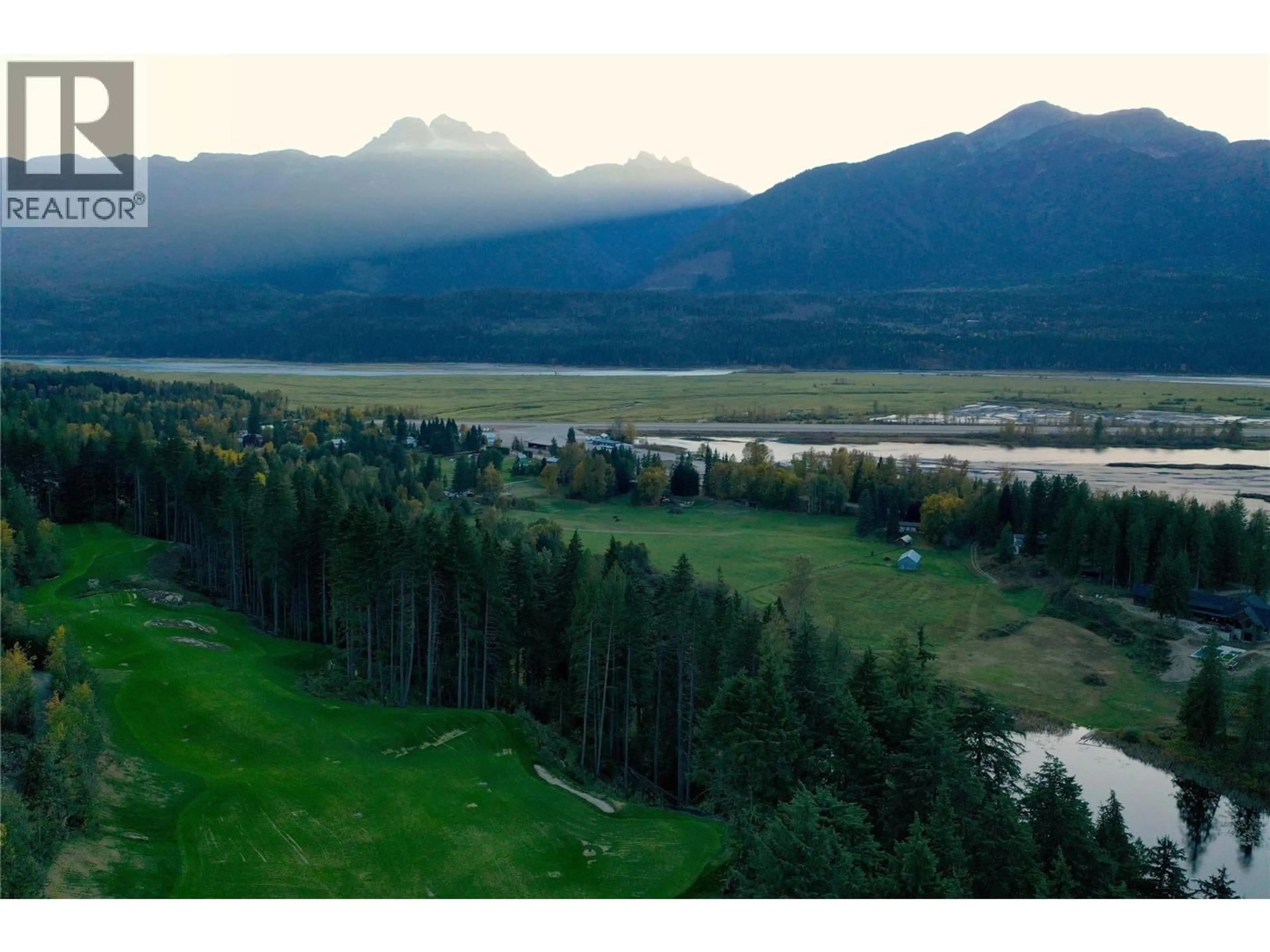 A pic from outside/outdoor area/front of a property/back of a property/a pic from drone, water/lake/river/ocean view for 2626 AIRPORT WAY, Revelstoke British Columbia V0E2S3