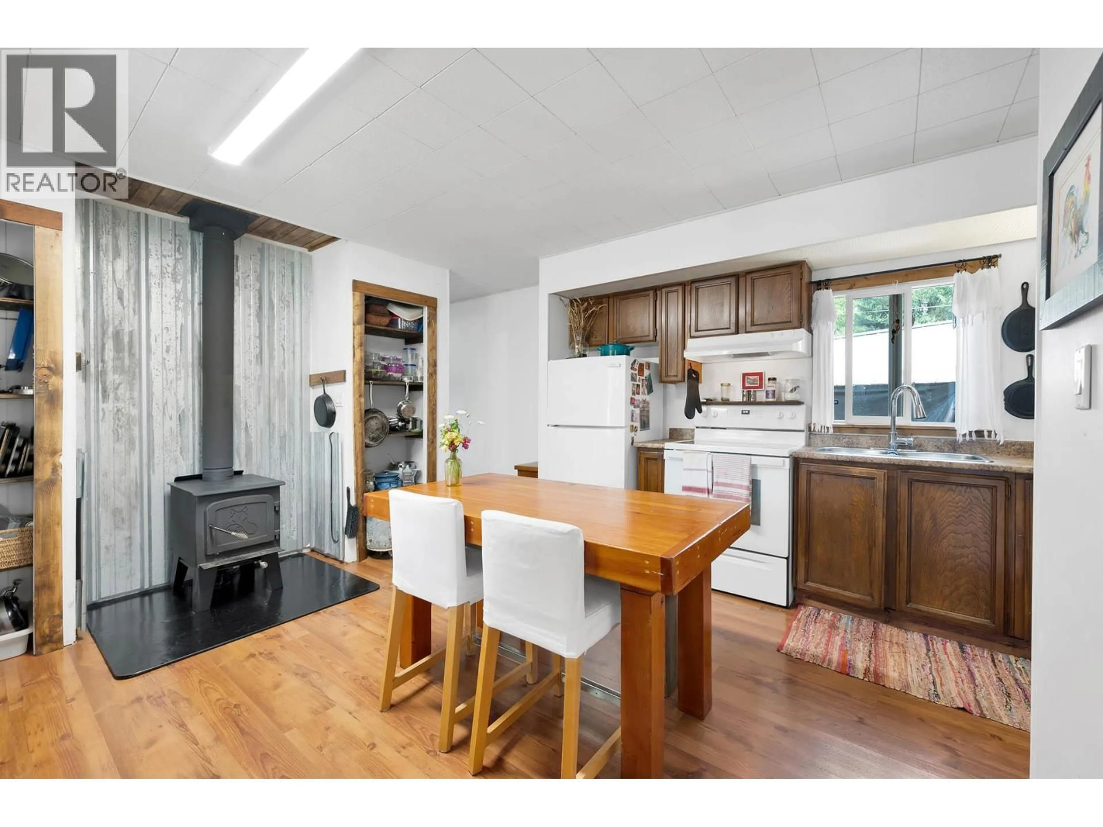 Open concept kitchen, wood/laminate floor for 429 WILDWOOD ROAD, Clearwater British Columbia V0E1N1