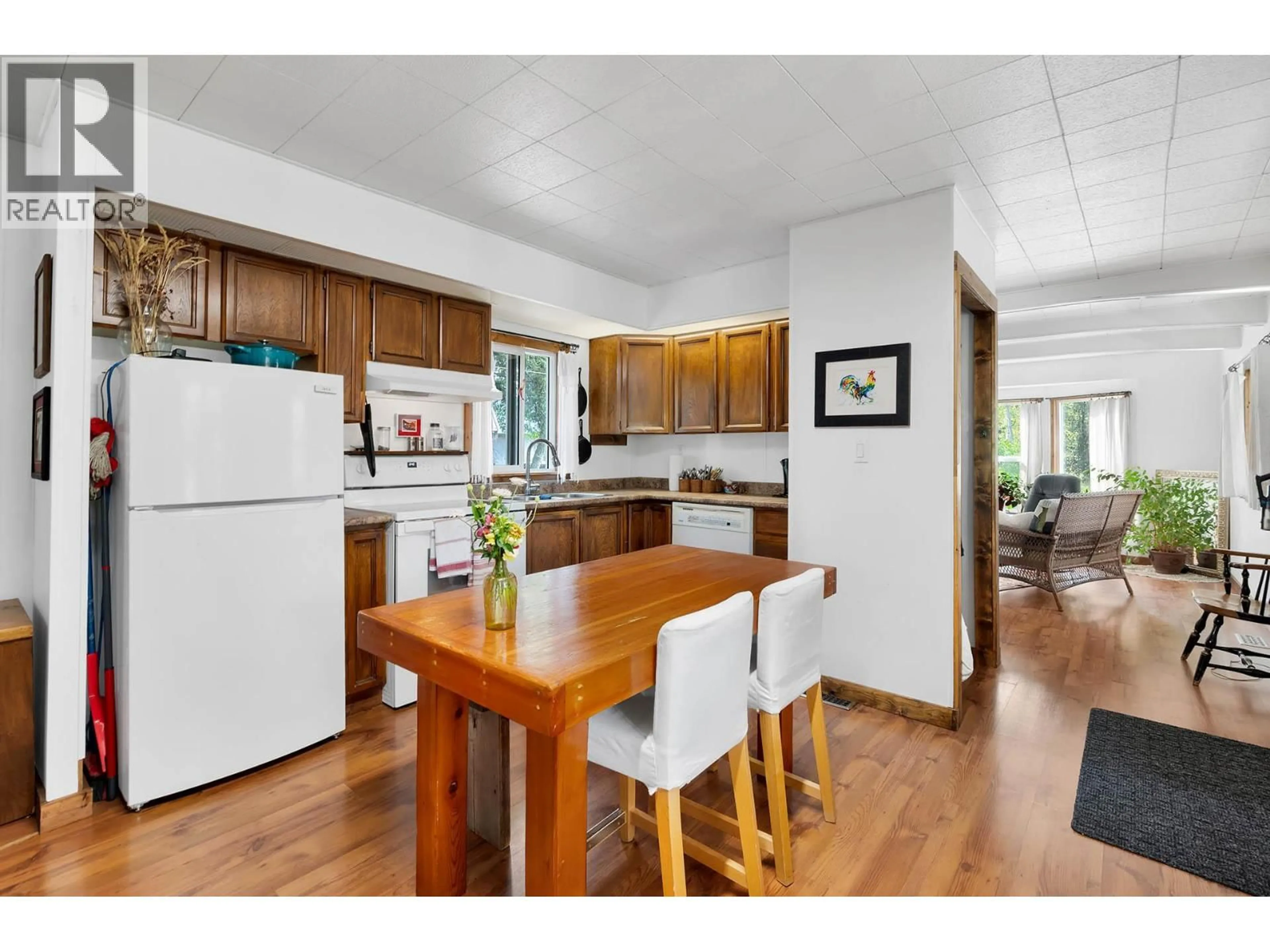 Open concept kitchen, wood/laminate floor for 429 WILDWOOD ROAD, Clearwater British Columbia V0E1N1
