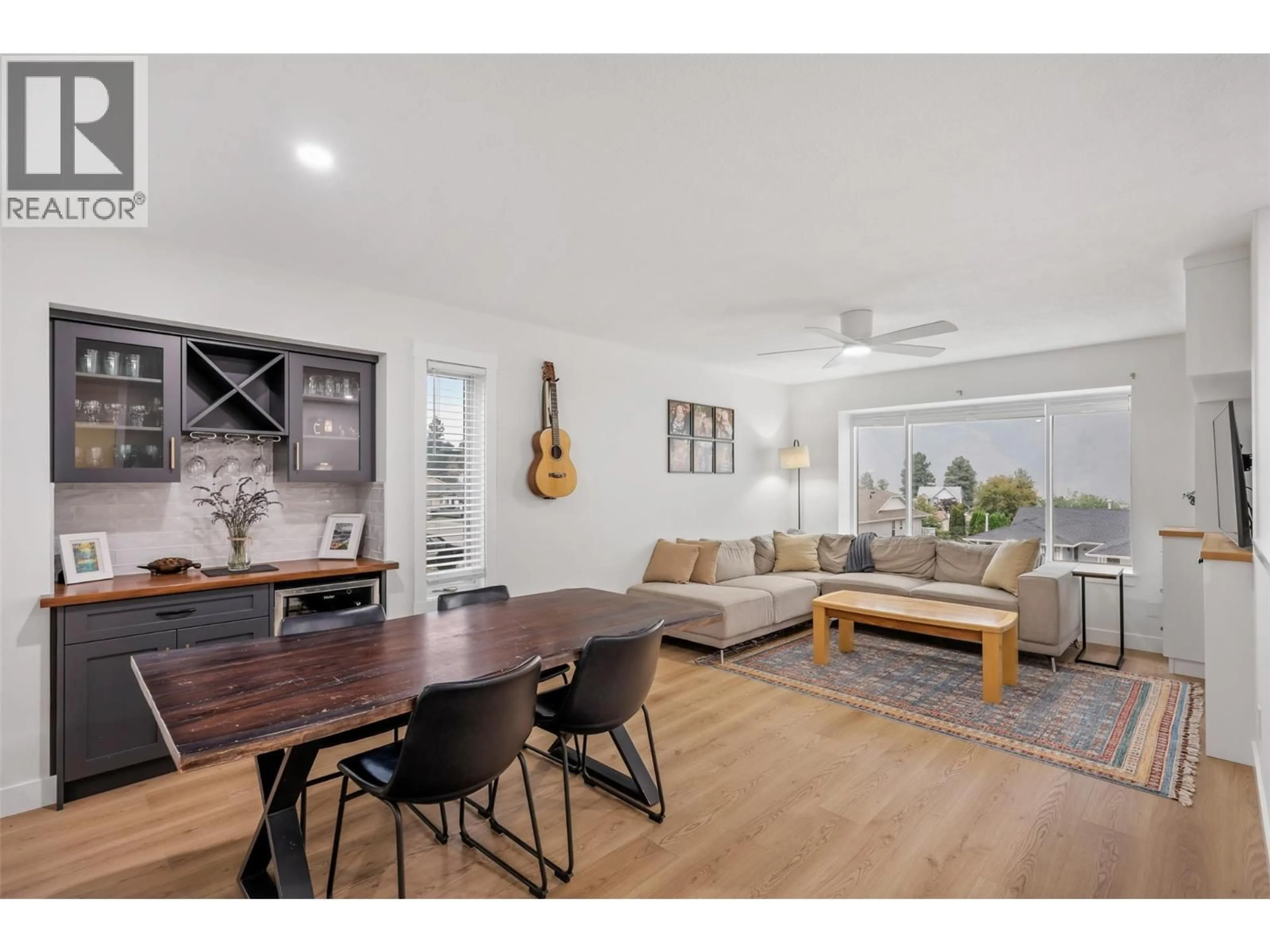 Living room with furniture, wood/laminate floor for 2753 QU'APPELLE BOULEVARD, Kamloops British Columbia V2E2J9
