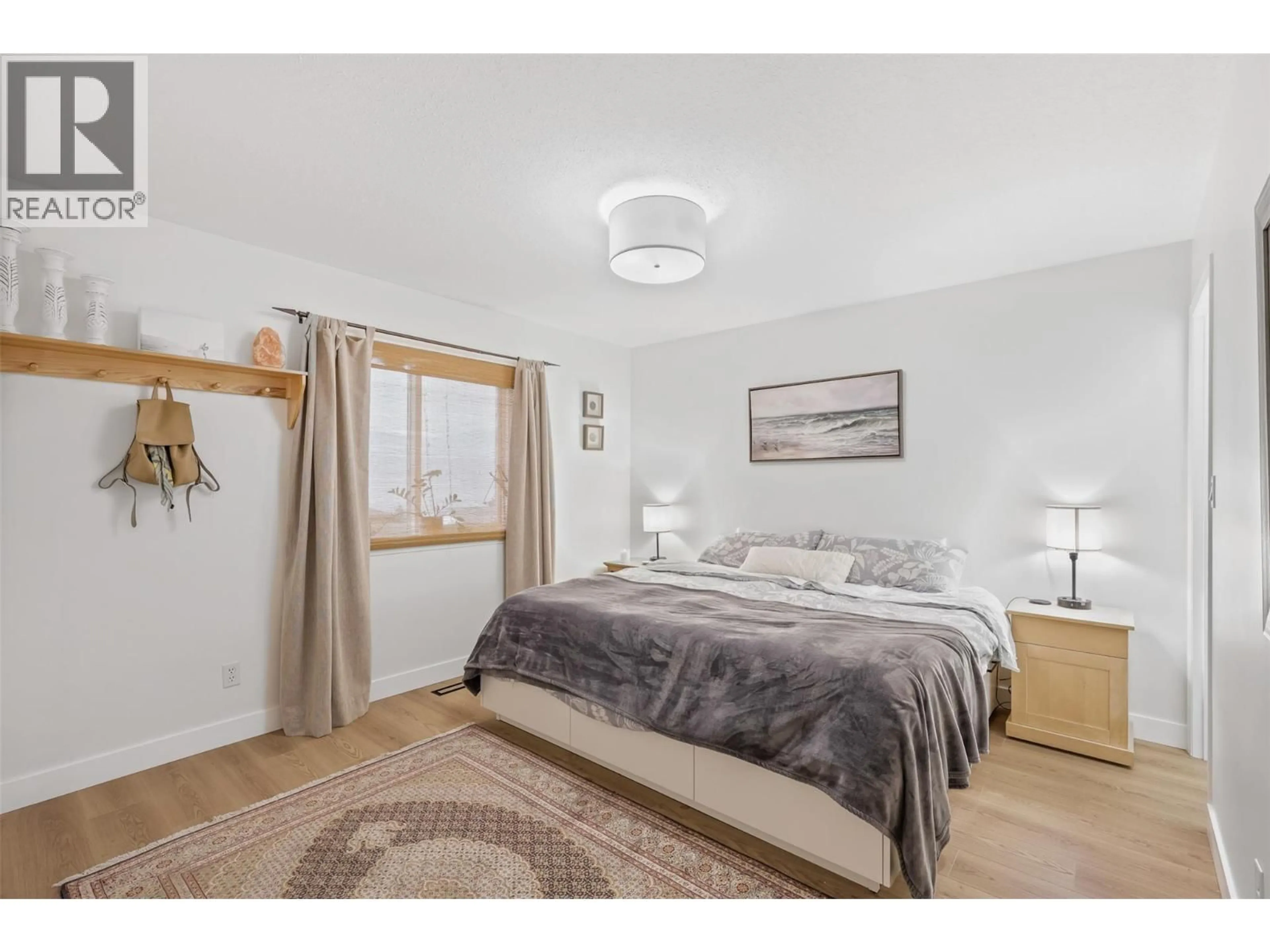 Bedroom with bed, wood/laminate floor for 2753 QU'APPELLE BOULEVARD, Kamloops British Columbia V2E2J9