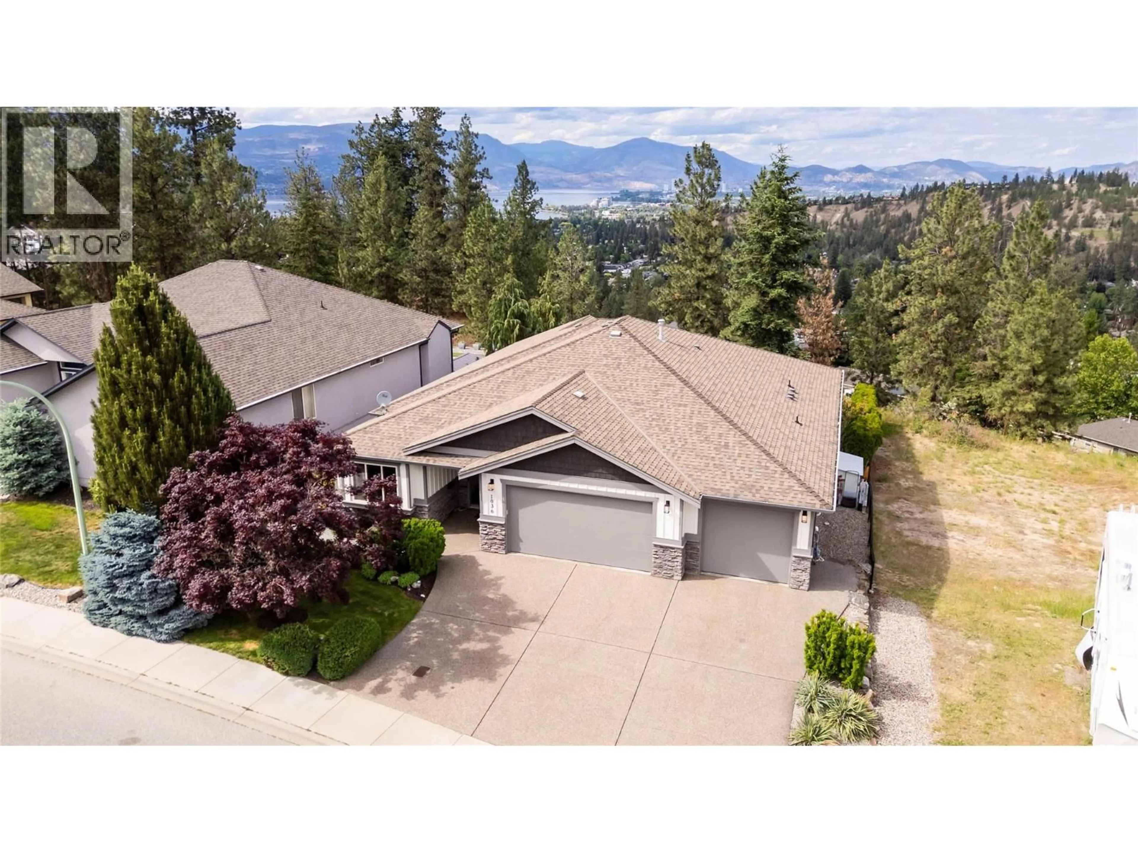 A pic from outside/outdoor area/front of a property/back of a property/a pic from drone, mountain view for 1036 ARBOR VIEW DRIVE, Kelowna British Columbia V1W5A1