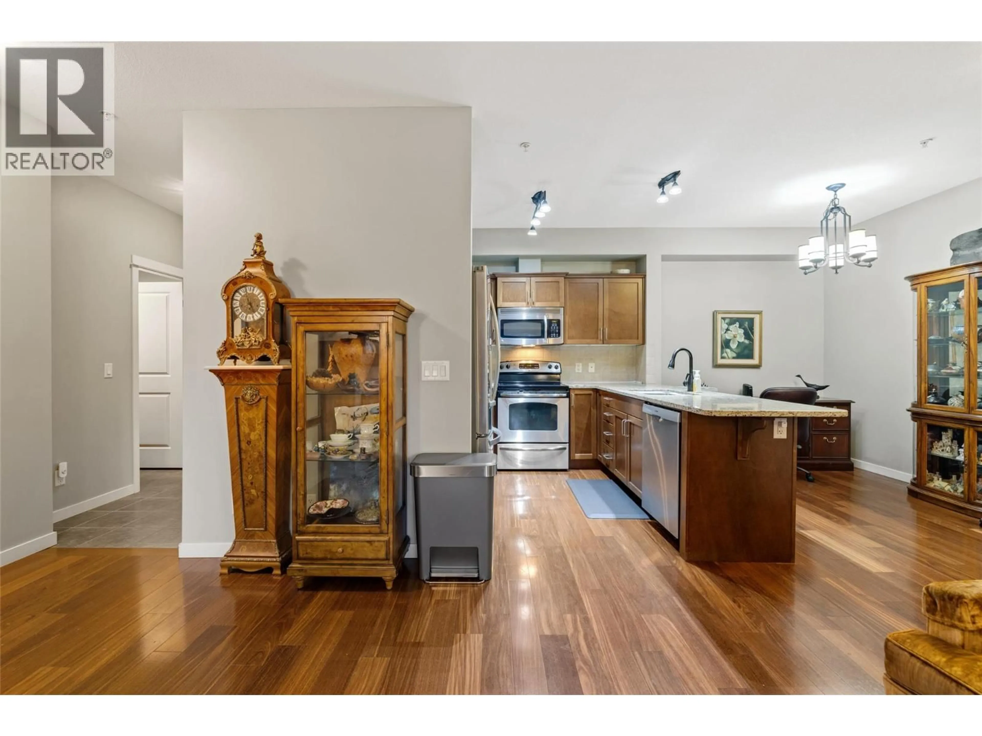 Open concept kitchen, wood/laminate floor for 107 - 2142 VASILE STREET, Kelowna British Columbia V1Y6H5