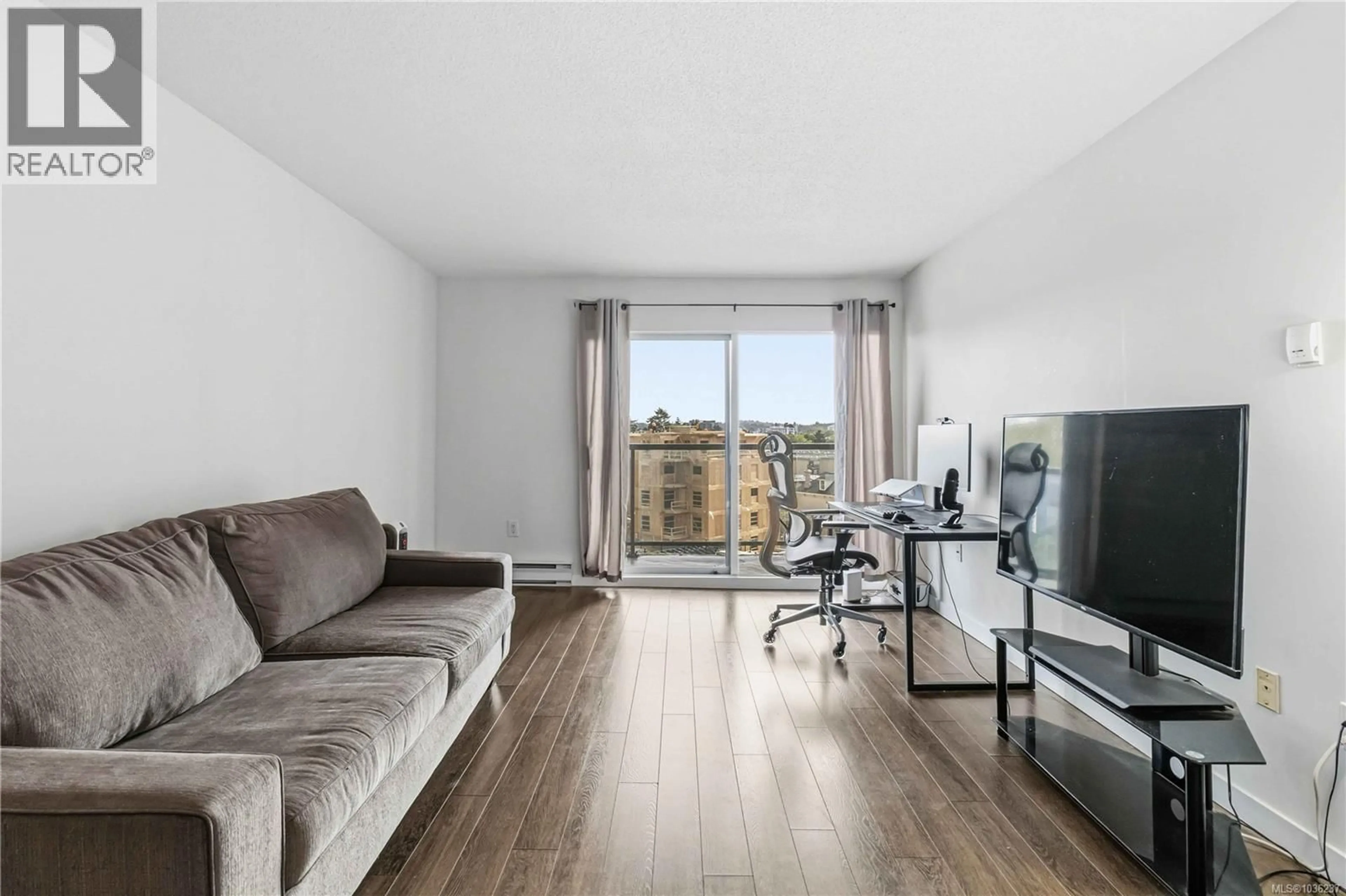 Living room with furniture, wood/laminate floor for 509 - 103 GORGE ROAD EAST, Victoria British Columbia V9A6Z2