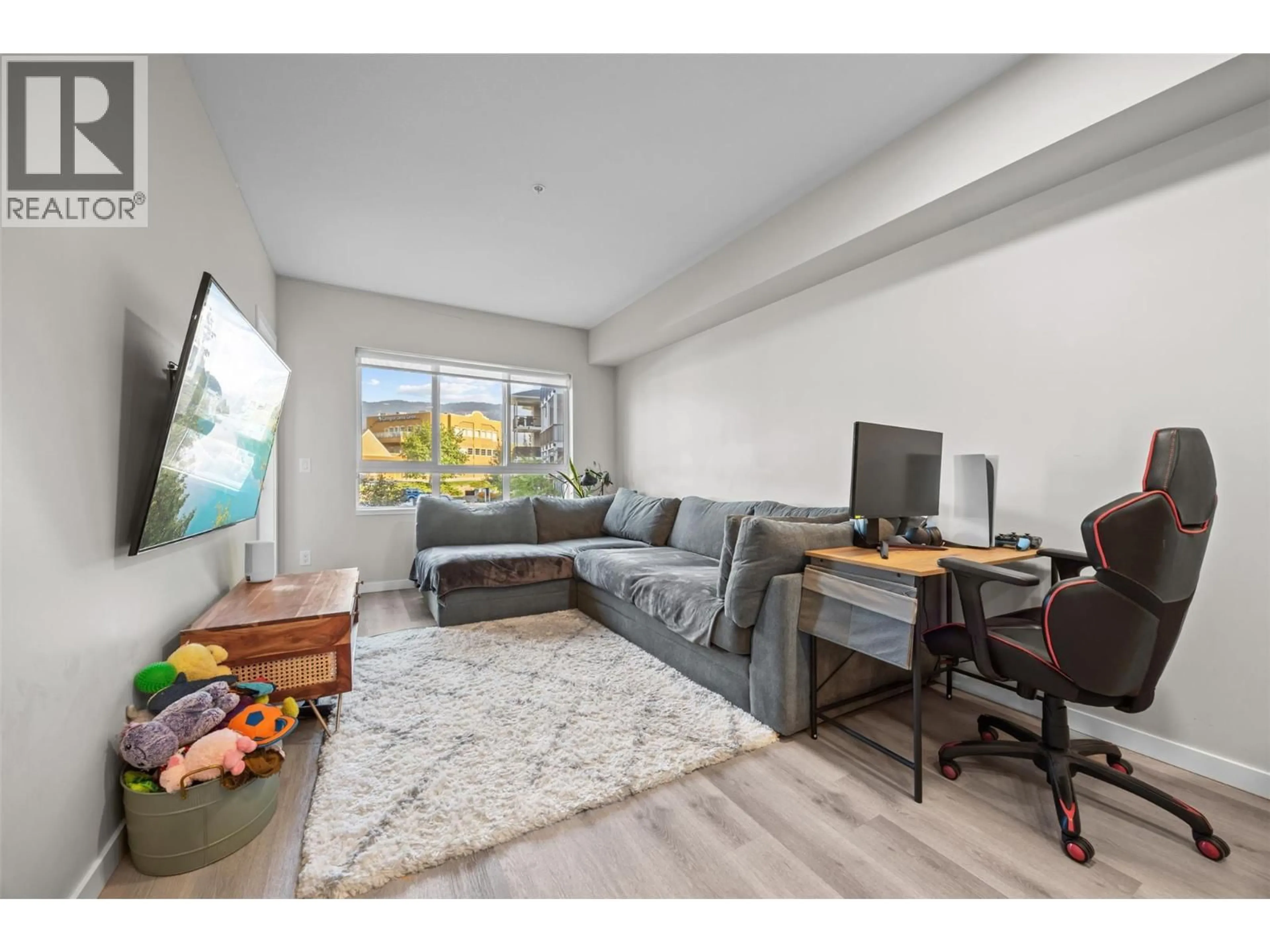 Living room with furniture, wood/laminate floor for 2301 CARRINGTON ROAD, West Kelowna British Columbia V4T0E2