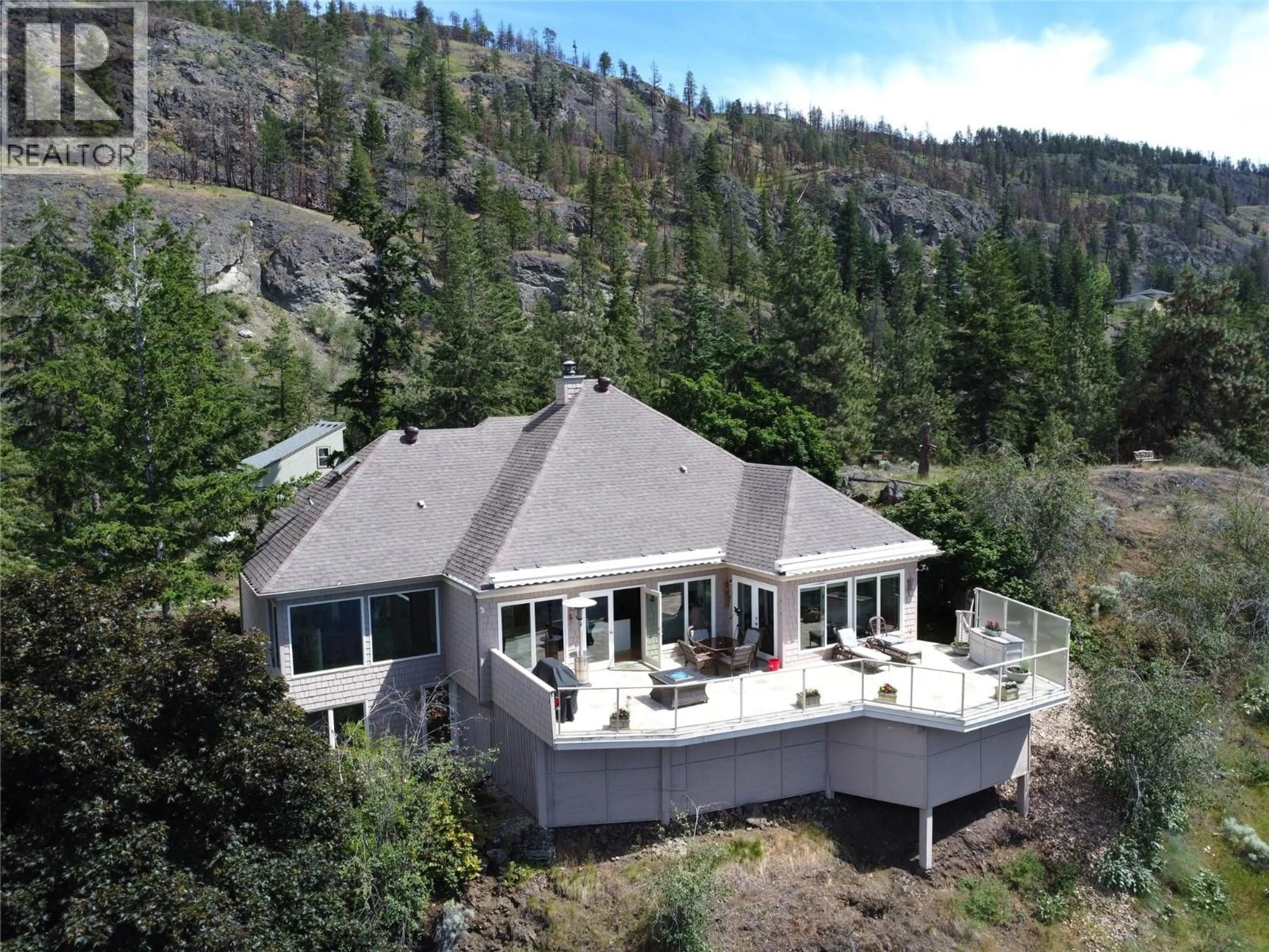 A pic from outside/outdoor area/front of a property/back of a property/a pic from drone, mountain view for 1116 LYNN COURT, Kelowna British Columbia V1Y1H1