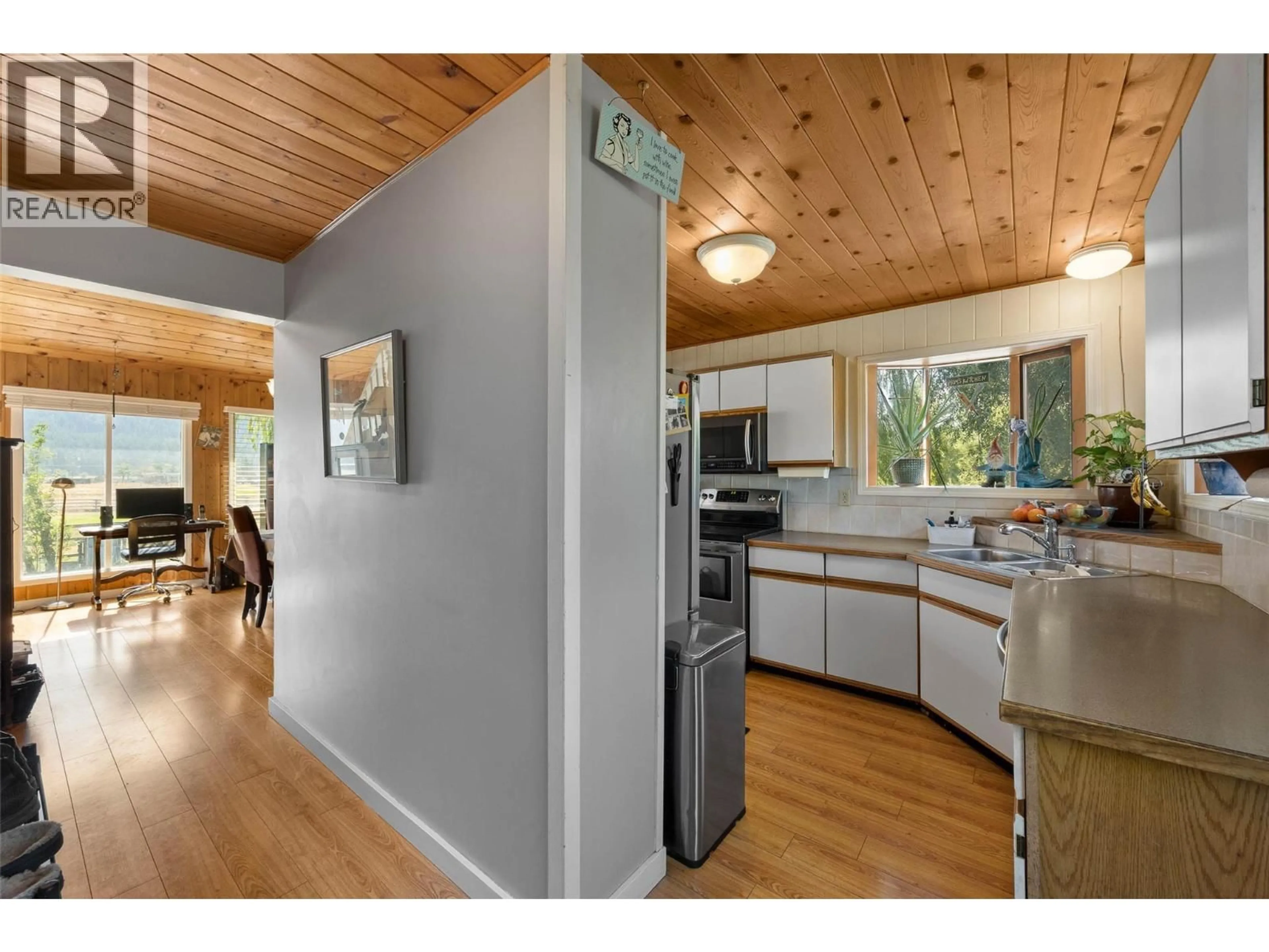 Open concept kitchen, wood/laminate floor for 1815 NICOLLS ROAD, Merritt British Columbia V1K1N7