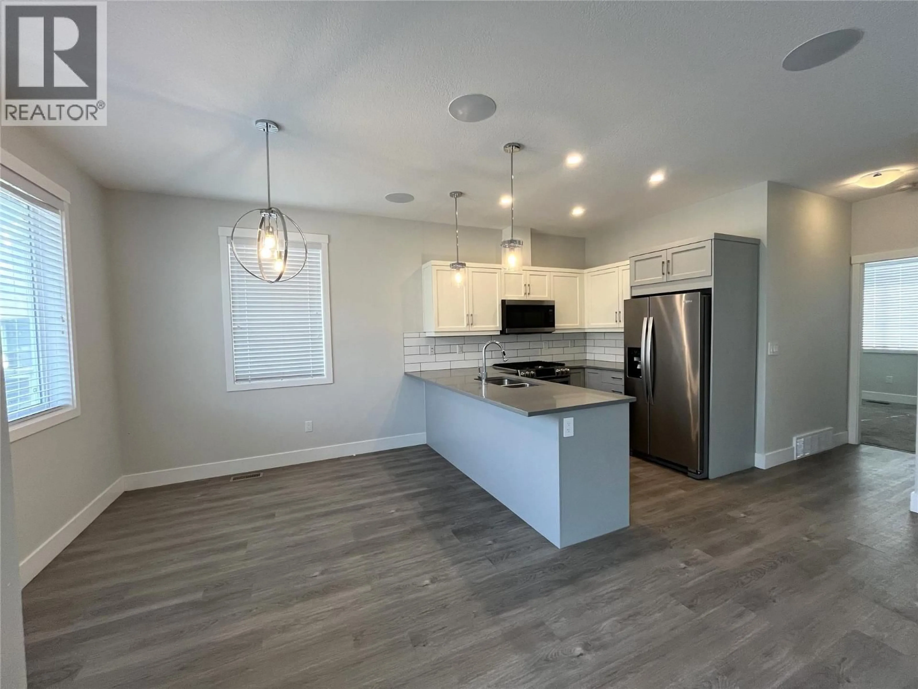 Open concept kitchen, wood/laminate floor for 179 - 200 GRAND BOULEVARD, Kamloops British Columbia V2C0H3